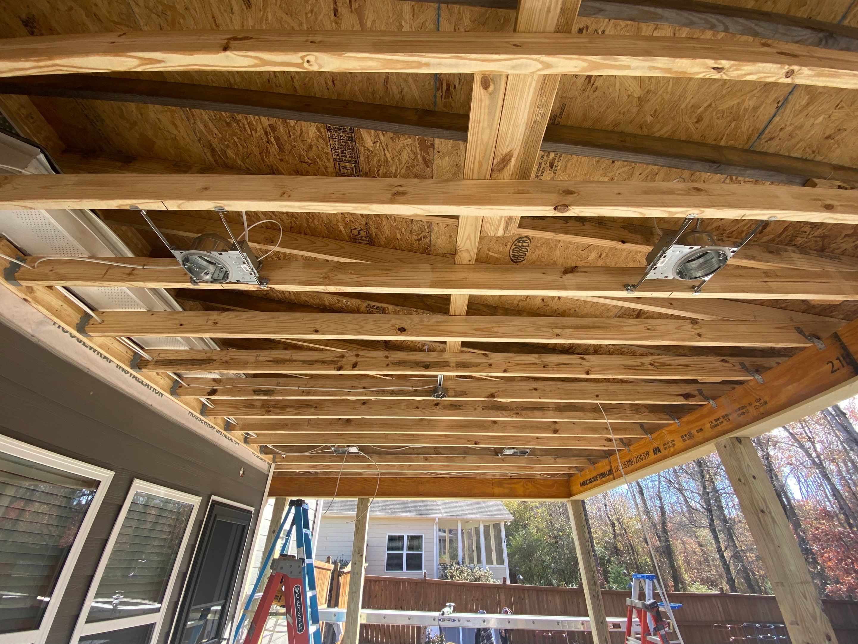 Screened-In Porch Construction With White Beadboard Ceiling In Cumming by Swift Home Renovations 