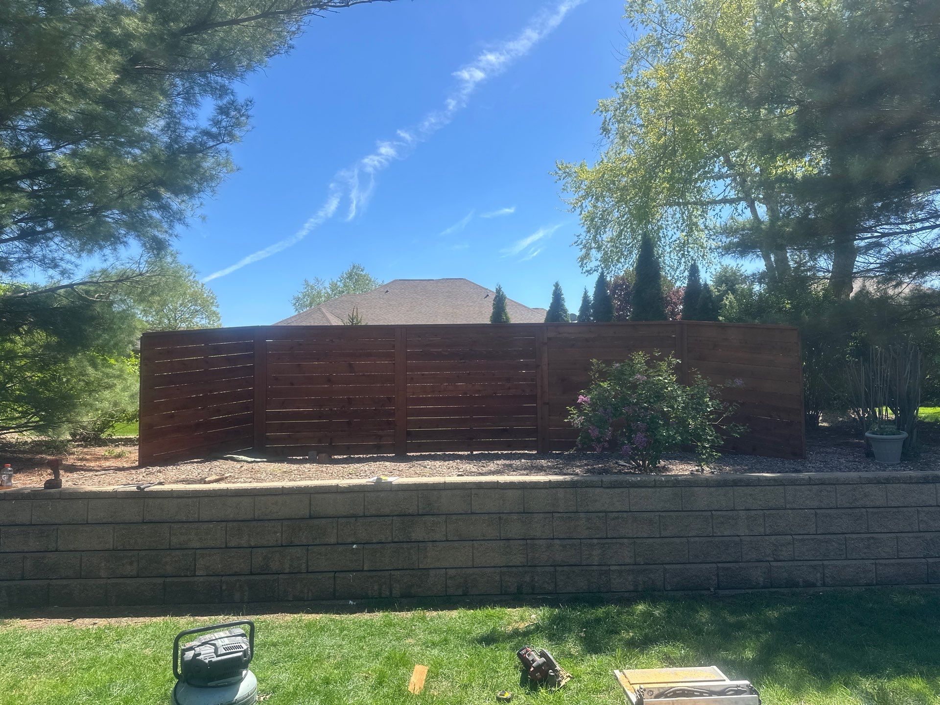 Horizontal Stained Wood Privacy Fence Installation in Waterloo by Perfect Picket Fence and Stain