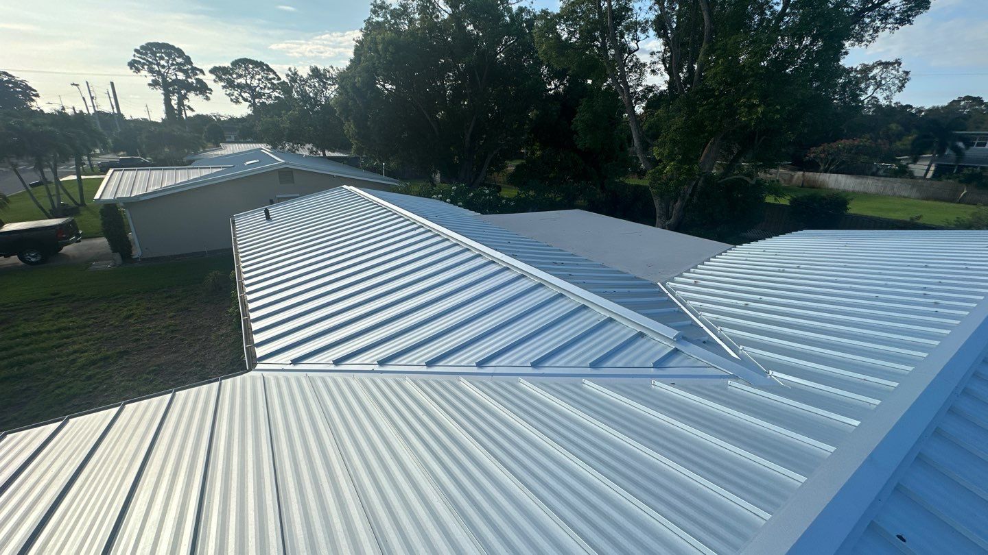 Standing Seam Metal Roof Replacement and New Gutters in Merritt Island by Wiedmann Construction & Roofing