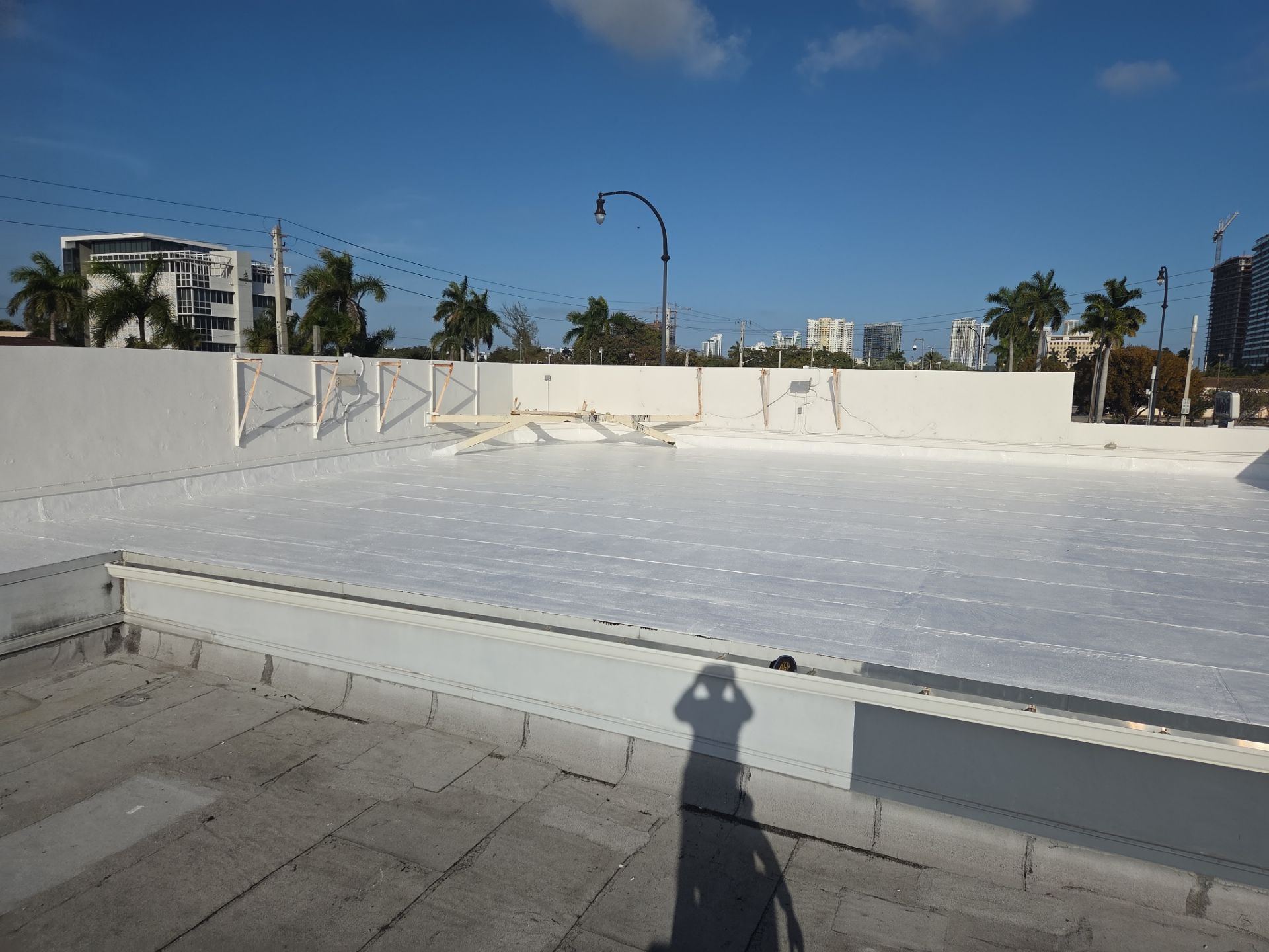 Commercial Flat Roof Restoration Using Silicone Coating in Hallandale Beach by Aastro Roofing