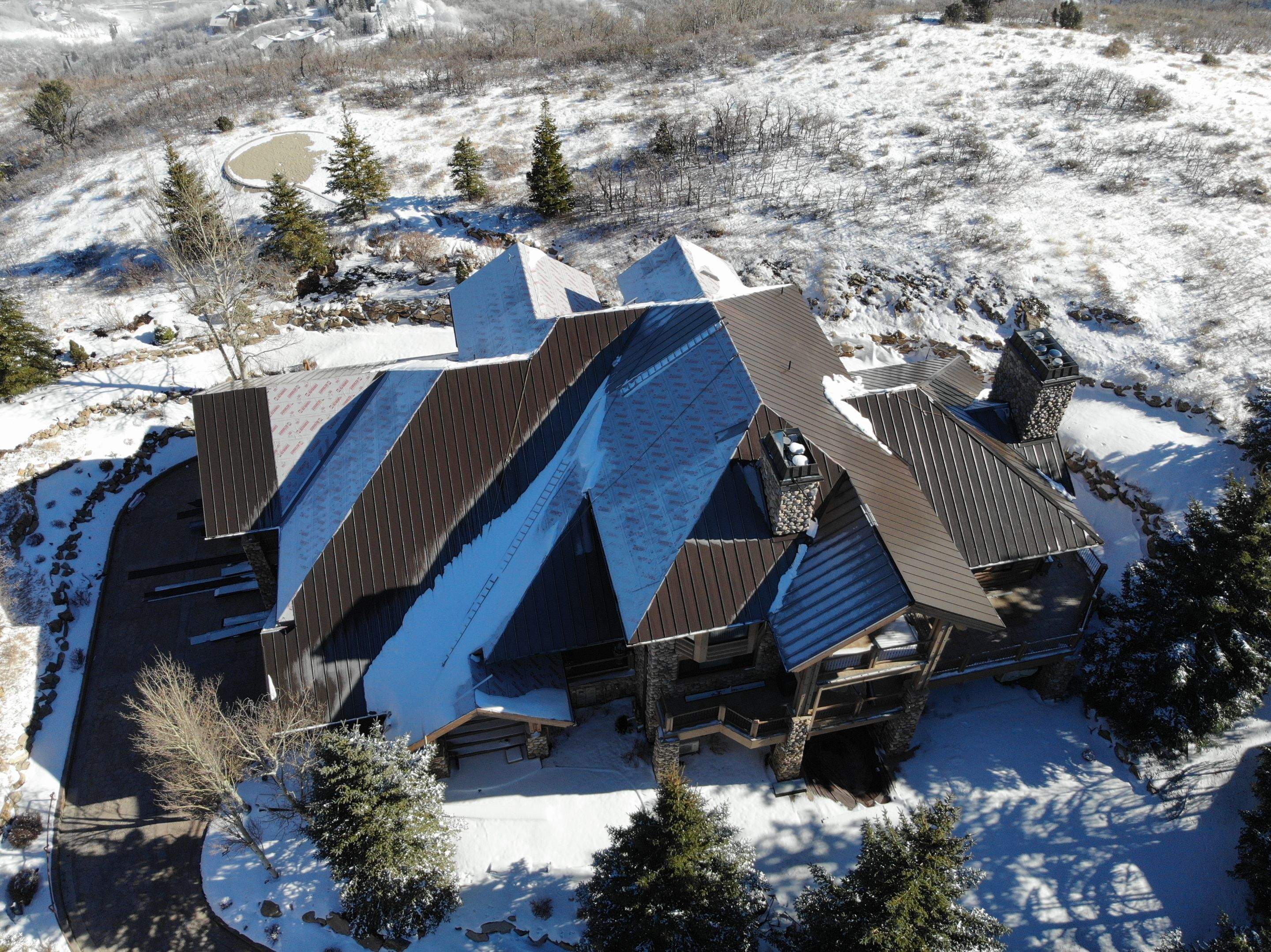 Standing Seam Metal Roof Replacement After Snow Damage by ASAP Roofing & Restoration