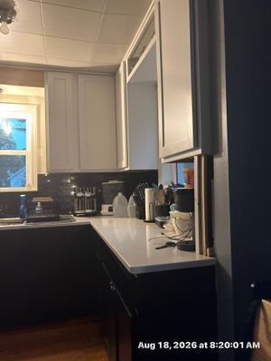 Lincoln Kitchen Renovation Featuring Black and White Shaker Cabinetry