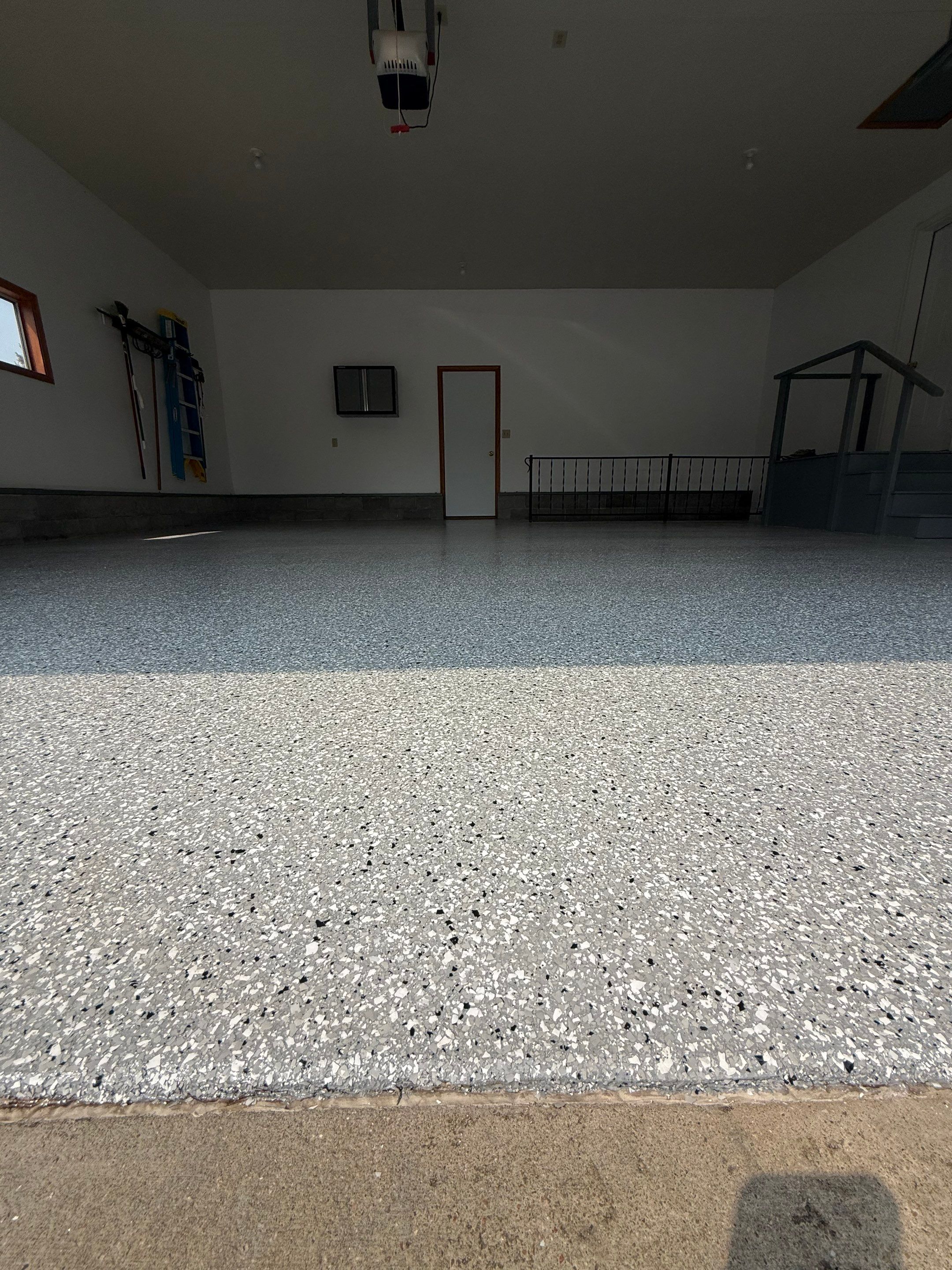Feather Grey Garage Floor Coating and Concrete Restoration in Mitchell by Select Painting, Coatings & Garage Cabinets