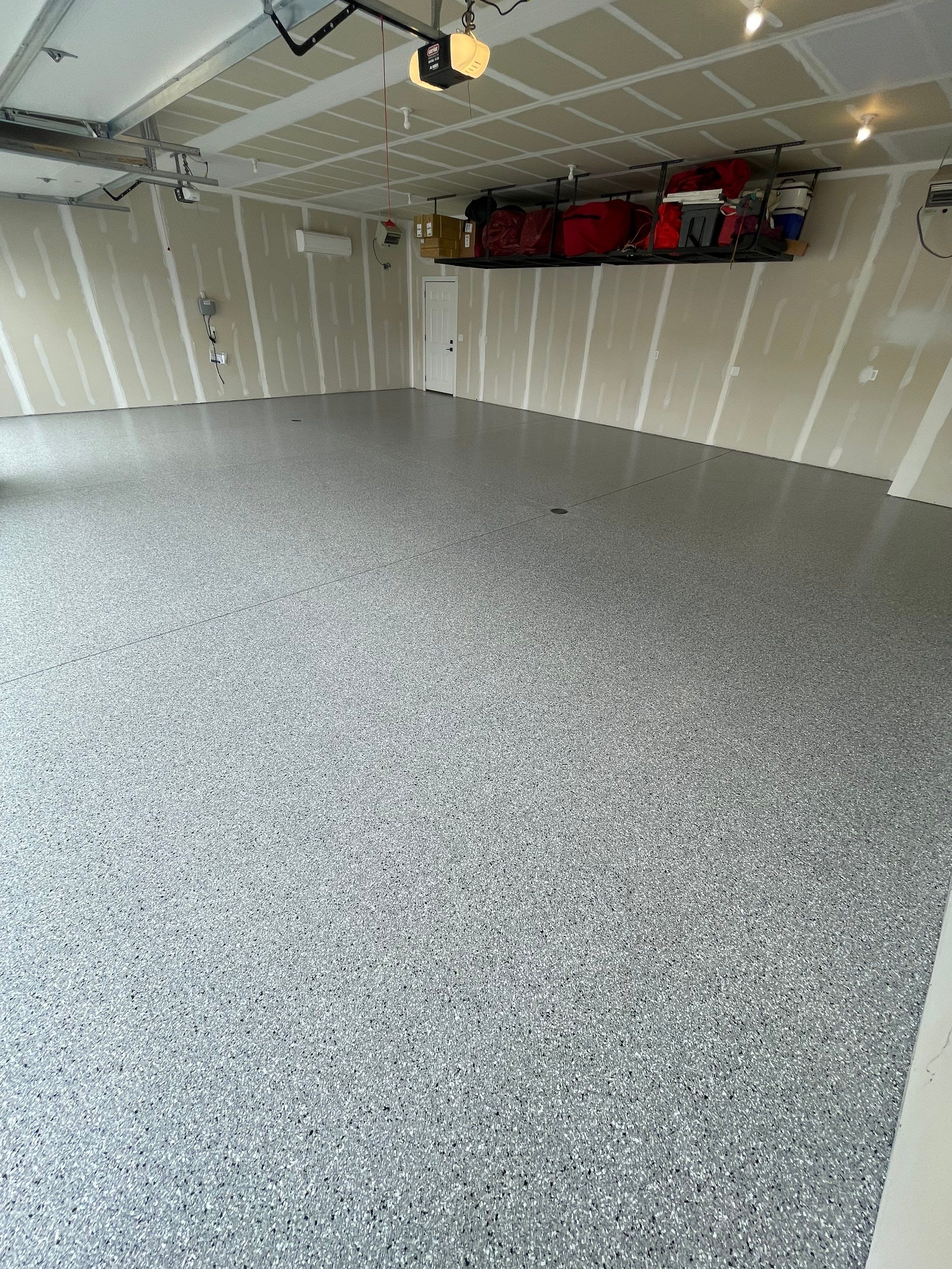 Grey Speckled Epoxy Floor Coating for Sioux Falls Garage by Select Painting, Coatings & Garage Cabinets