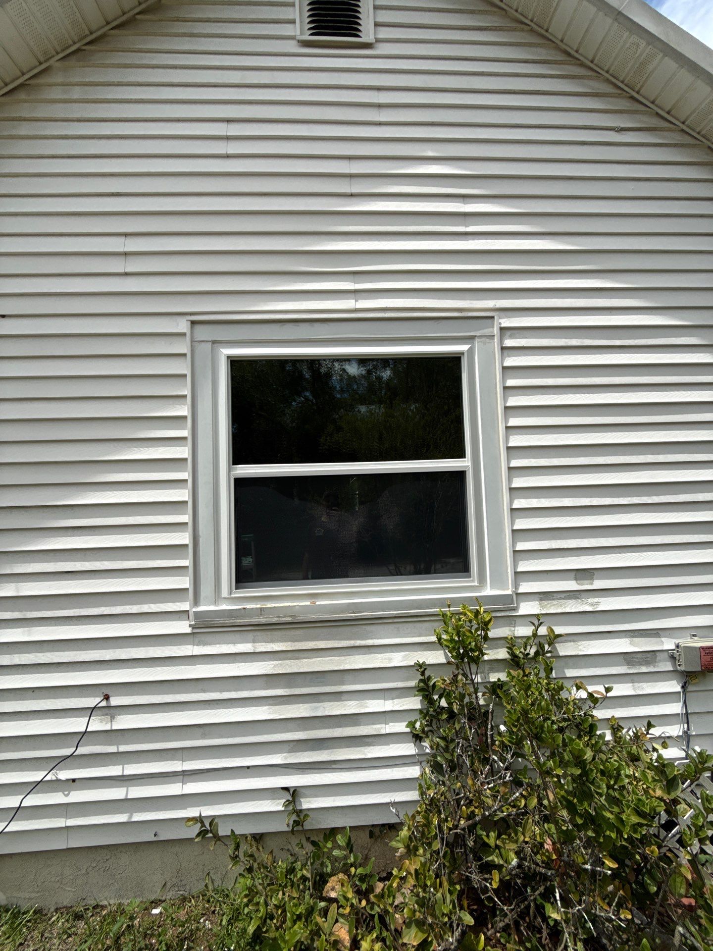 White Vinyl Window Replacement for Residential Home in Williston by Windows & Doors Store