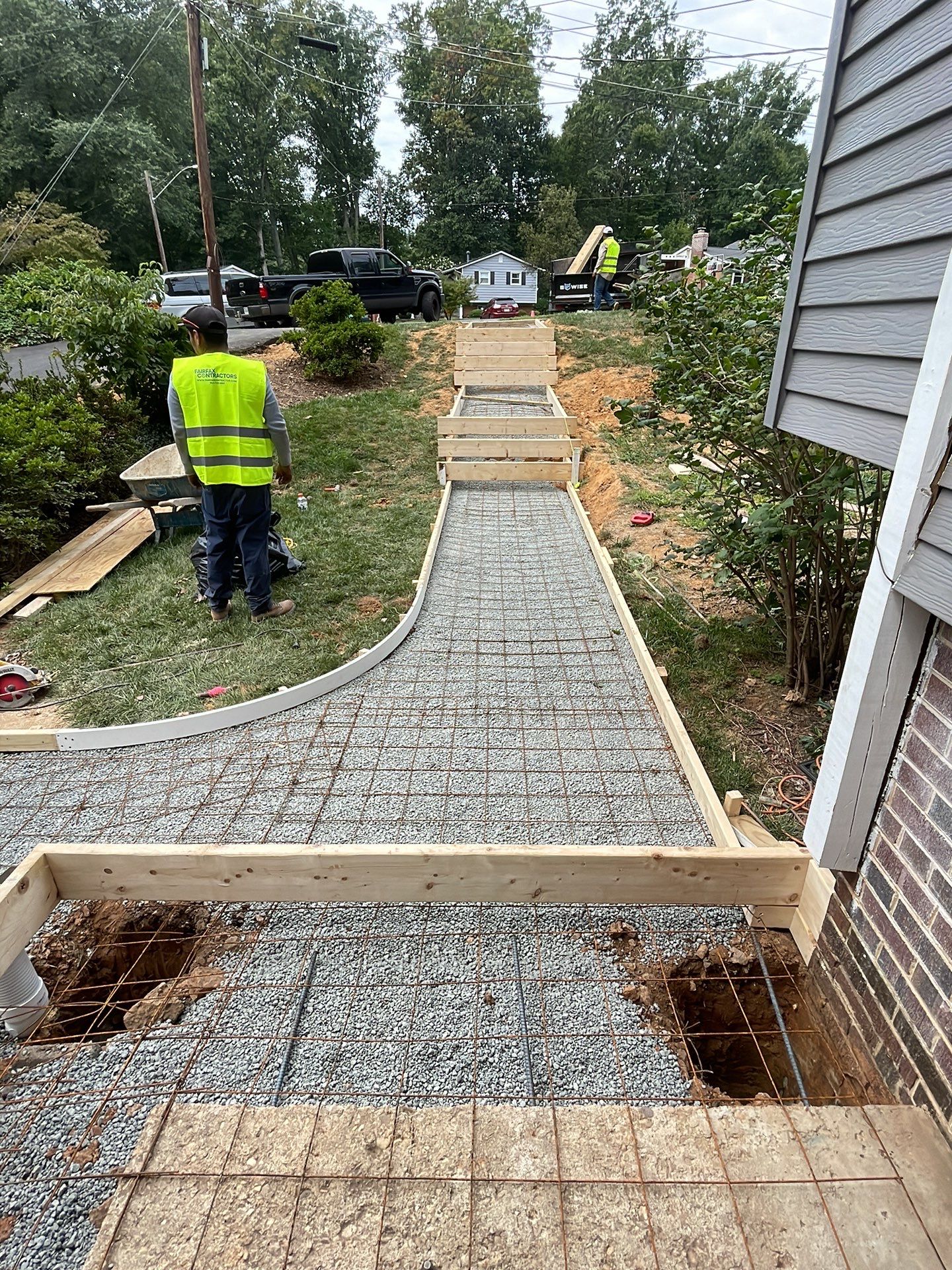 New walkway with stairs and a new front porch by Fairfax Contractors, LLC