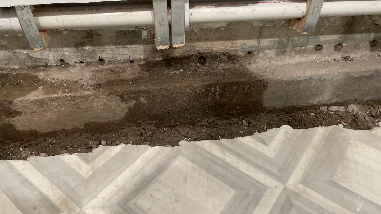Interior Drain Tile & Buried Discharge in St. Anthony, MN by Waterproofing Northeast