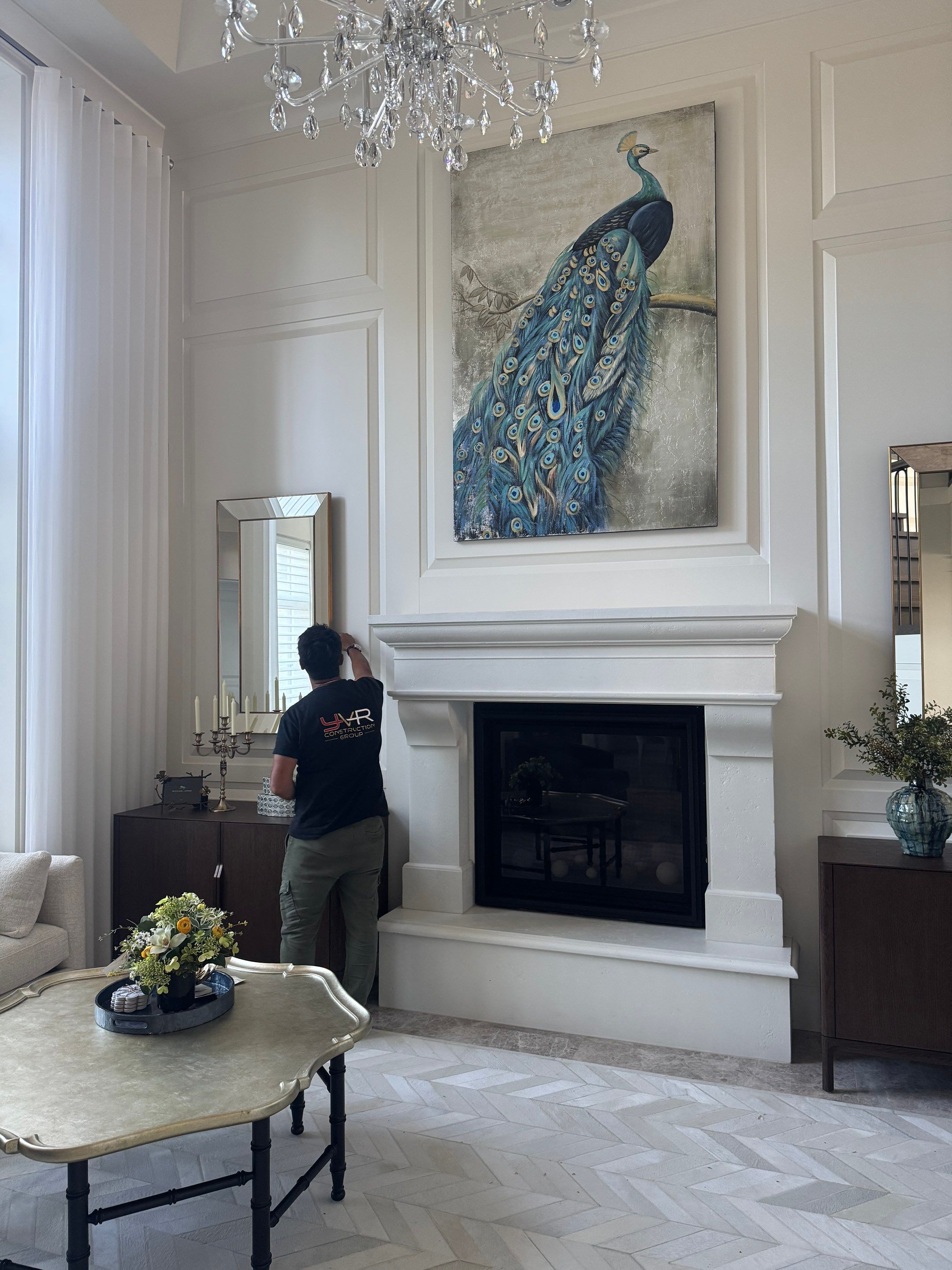 Professional Hanging of Mirrors & Art in a Designer Home by YVR Construction Group