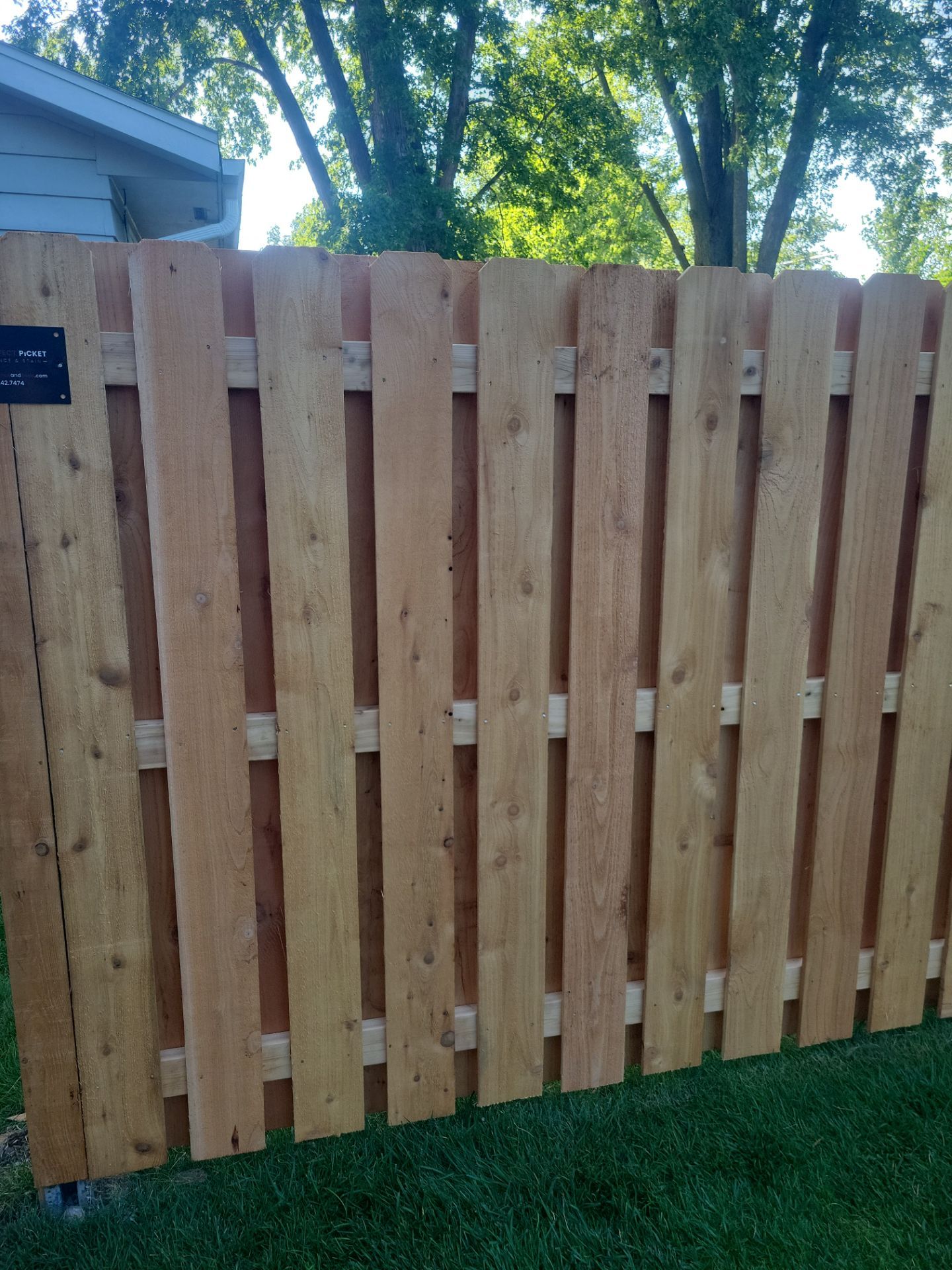 Unstained Cedar Wood Privacy Fence Installation in Cedar Falls by Perfect Picket Fence and Stain