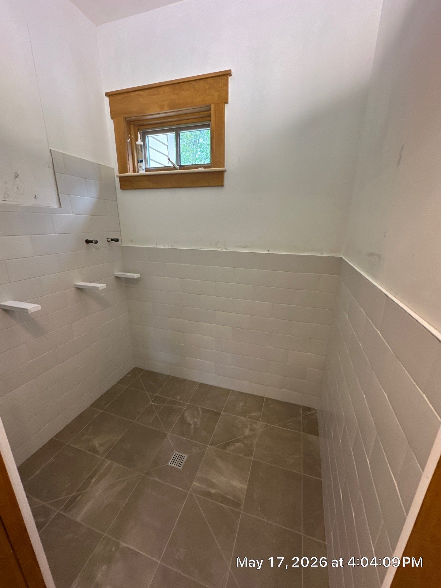 Mudroom and dog wash tile project by Renovatic LLC