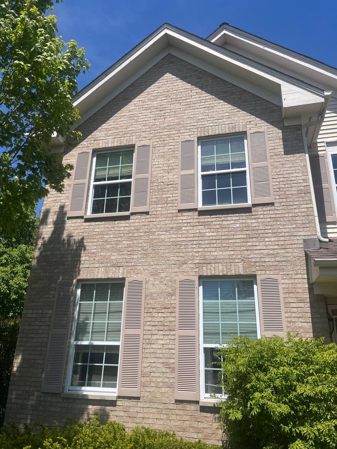 Housewashing  using Algaecide, soft wash soap by Northern Power Washing LLC.