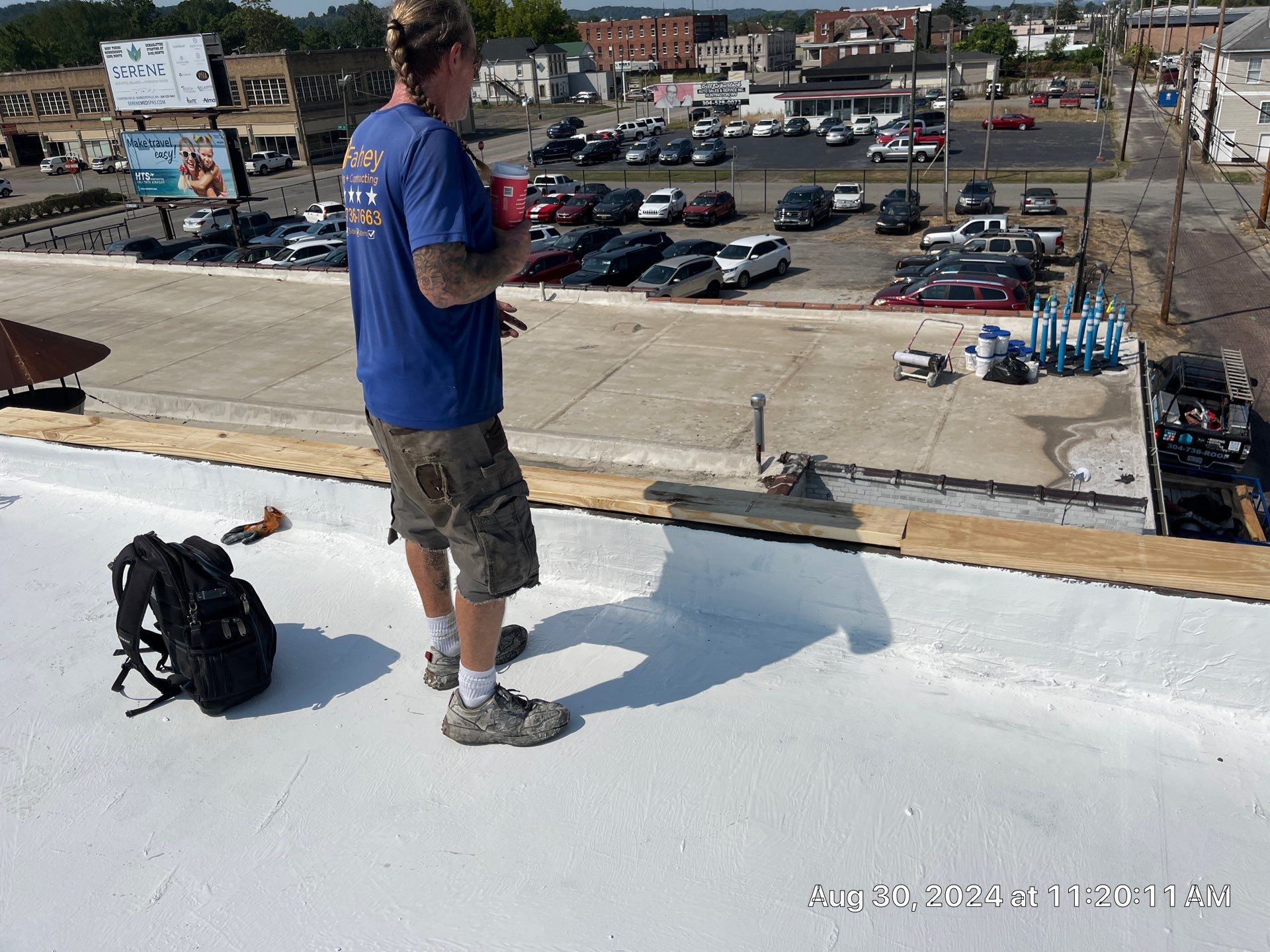 Commercial Roofing Installation using smartcoat Roof coating by Fahey Roofing + Contracting
