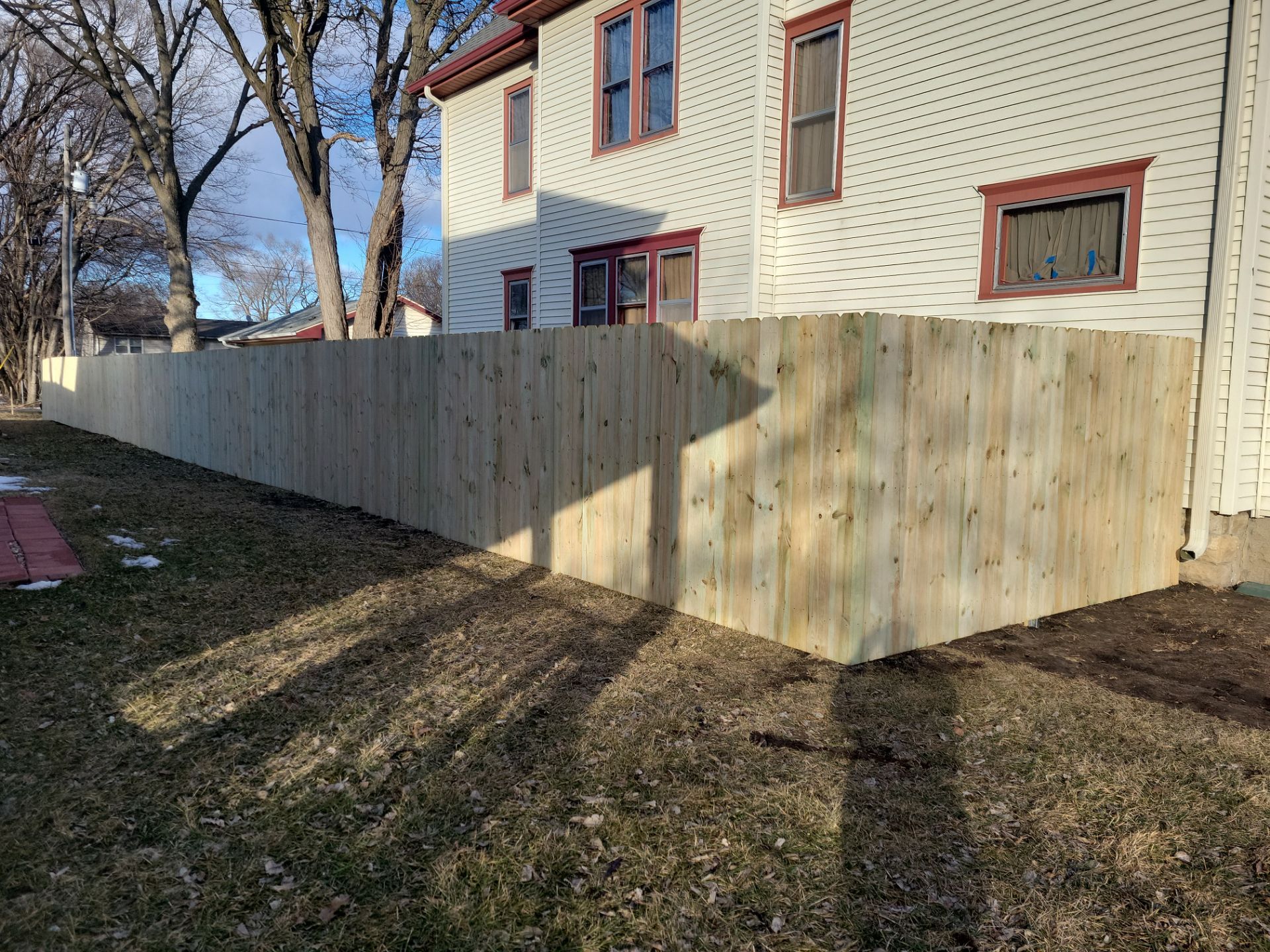Pressure-Treated Wood Privacy Fence and Double Gate Installation in Waterloo by Perfect Picket Fence and Stain
