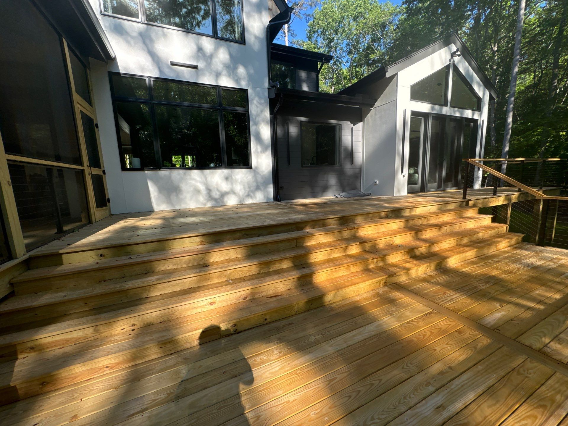 Porch and Deck staining  by GonzalezPainters & Contractors Inc 