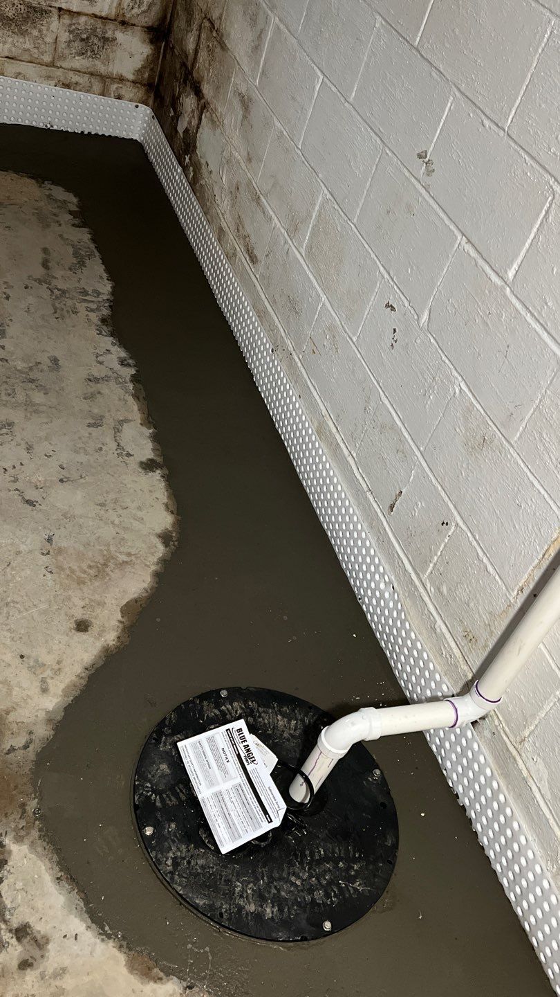 Interior drain tile system installation by ACE Waterproofing & Basement Solutions