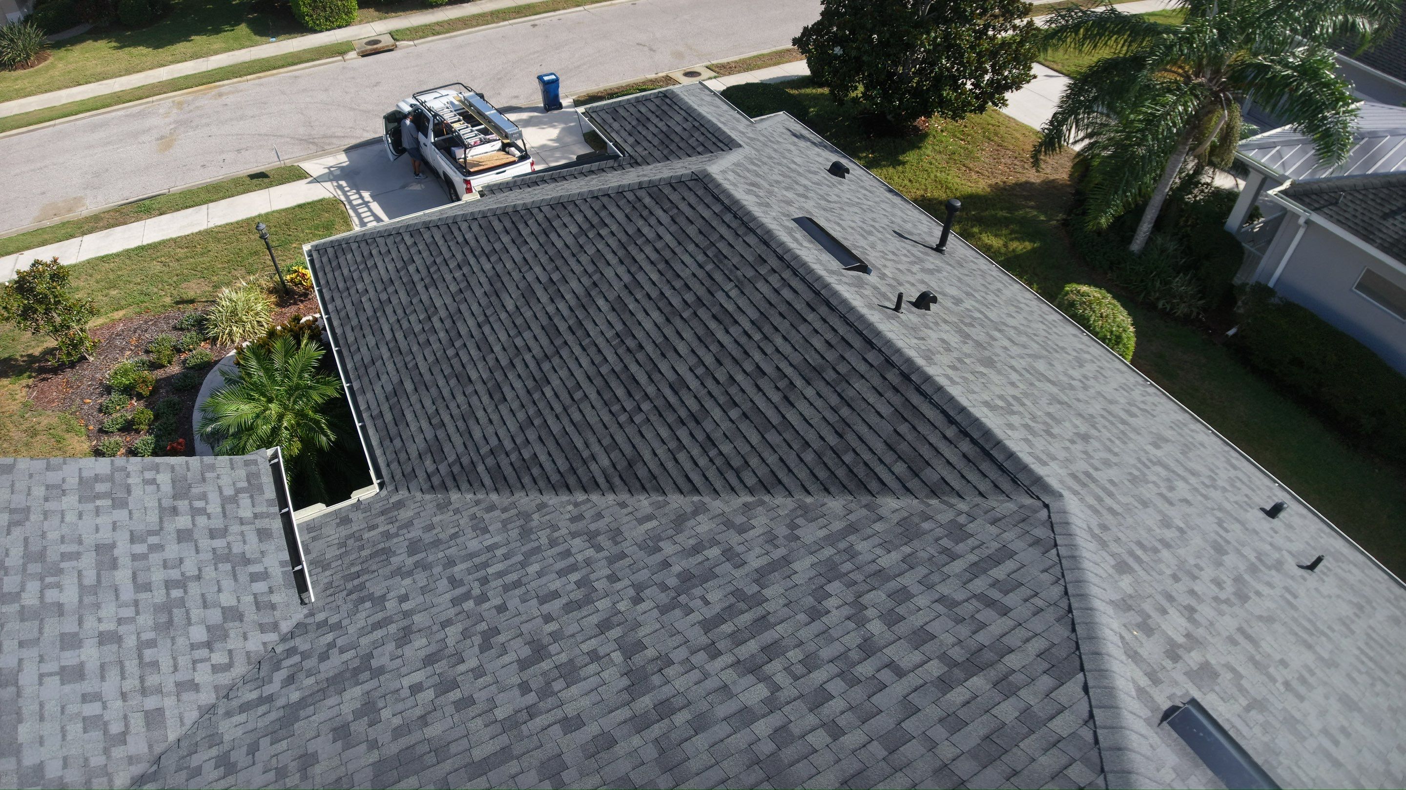 Residential Roof Installation With Estate Grey Architectural Shingles in Bradenton by Trinity Restoration and Roofing LLC