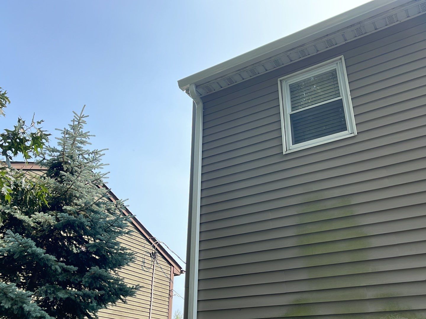 Gutter Installation using 5k White gutters by A Plus Exterior