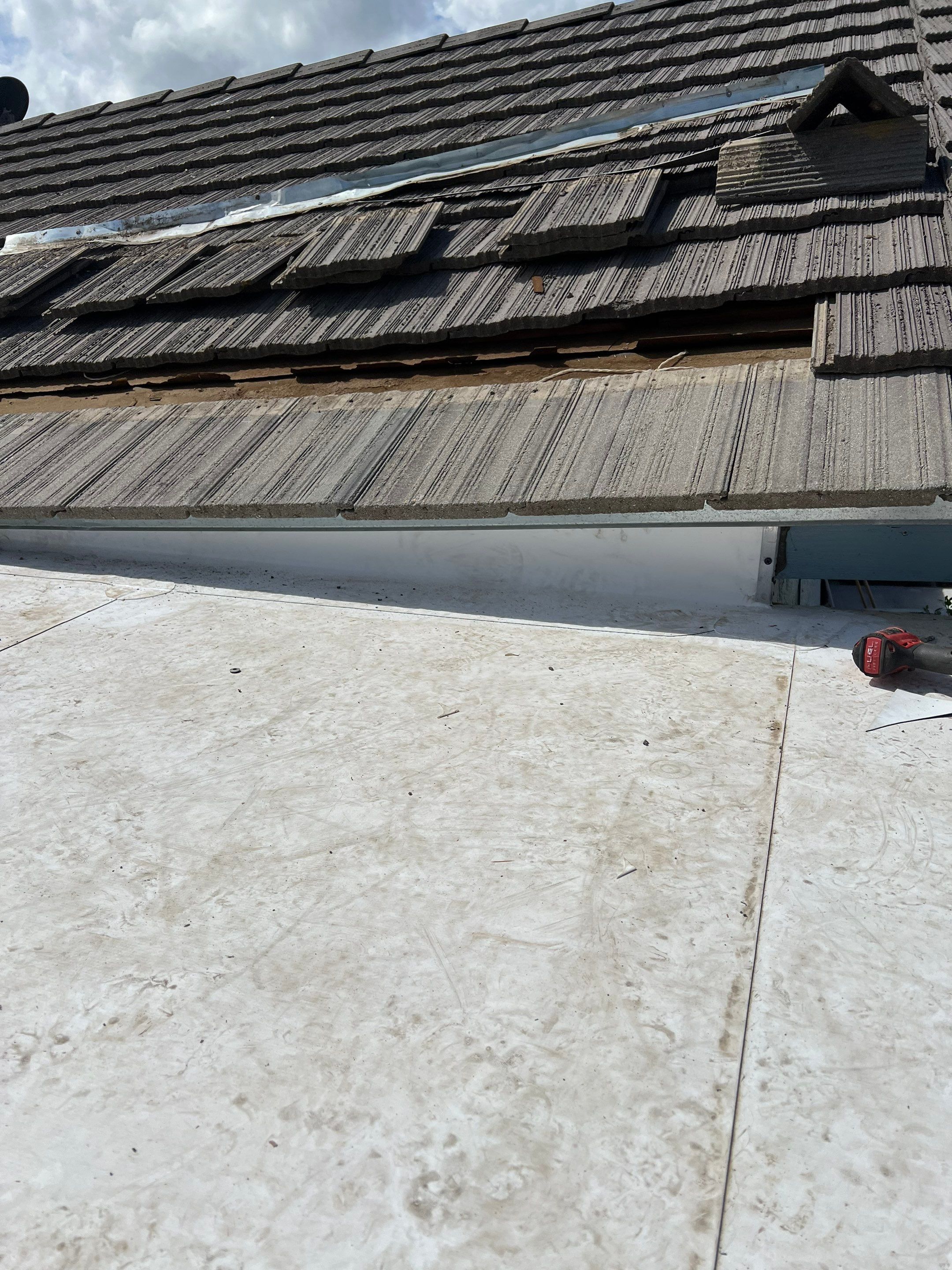 Single-ply roofing system on porch using TPO 60 mil by Straight Edge Roofing Inc