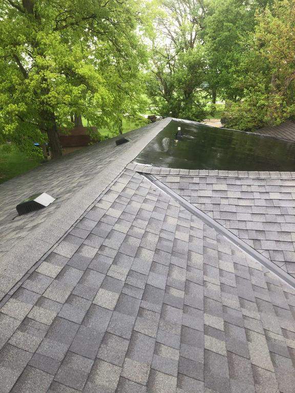 Residential Roofing Installation using 60 mil rubber roof  by Nitro Roofing and Construction