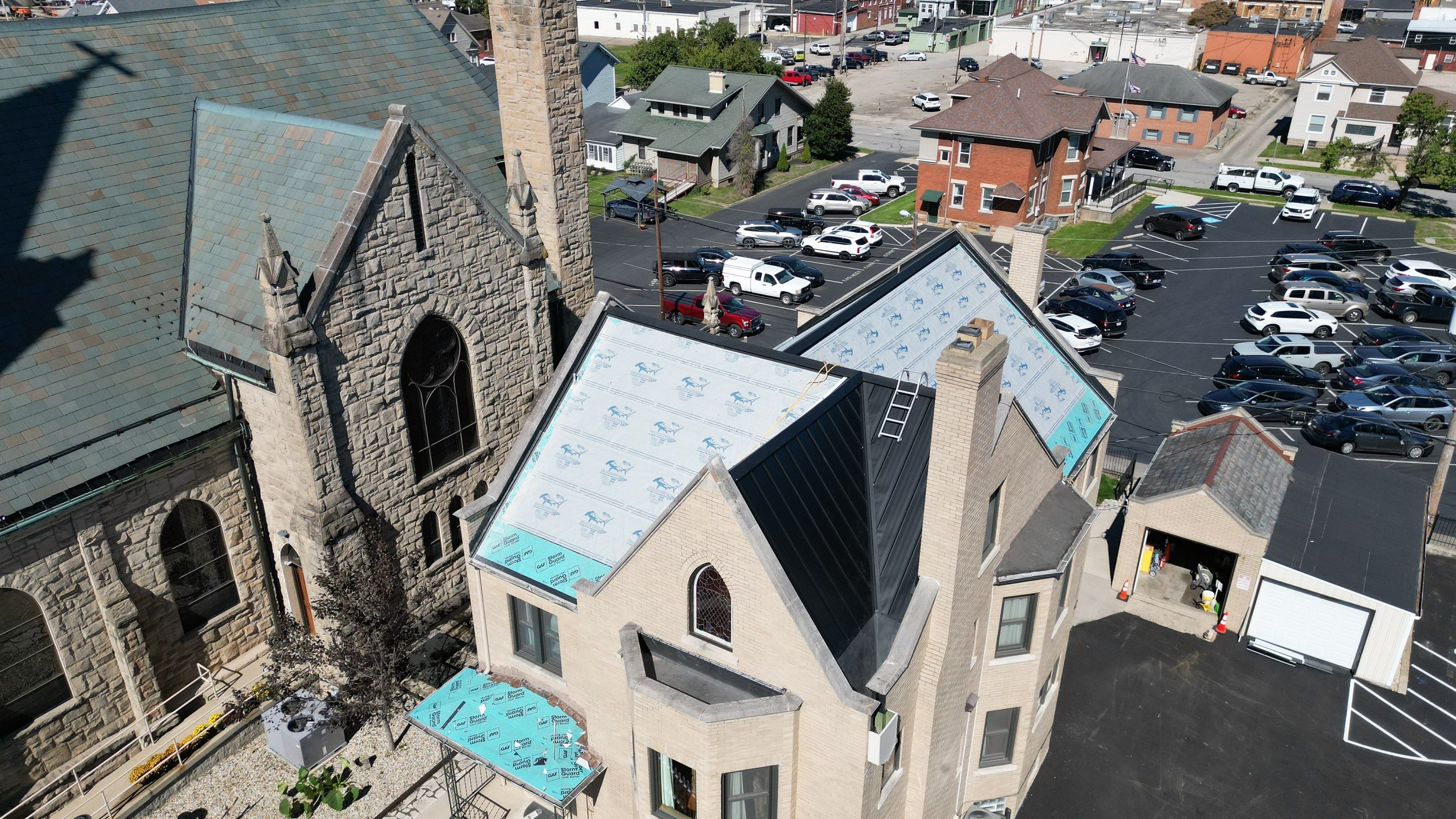 Commercial Roofing Installation using Standing Seam Metal - Frost Black by RoofX 