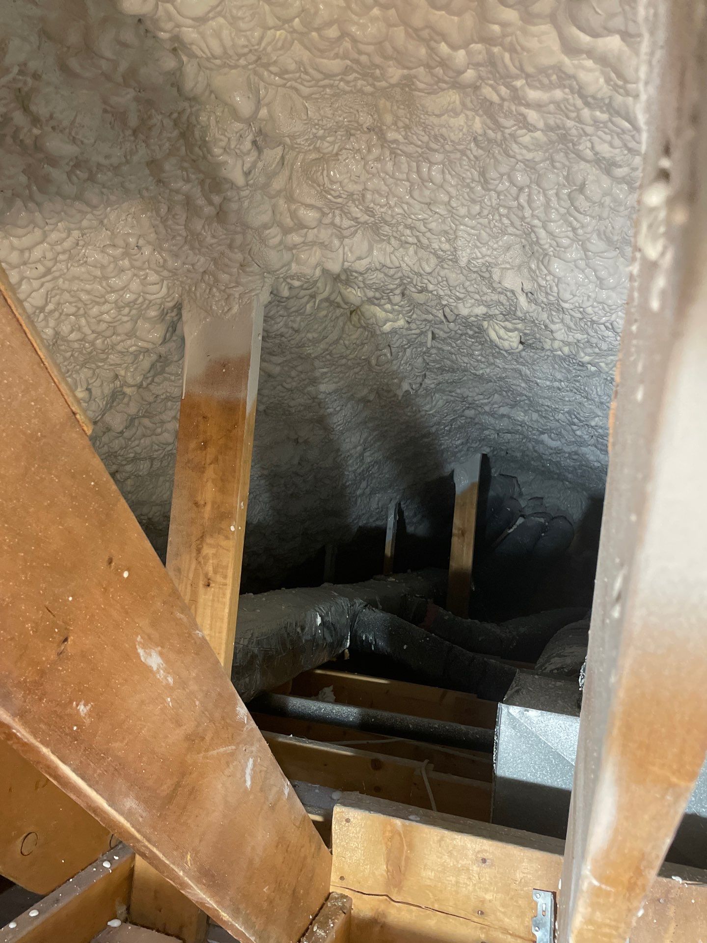 Attic Insulation using open cell spray foam by NYS Foam & Energy