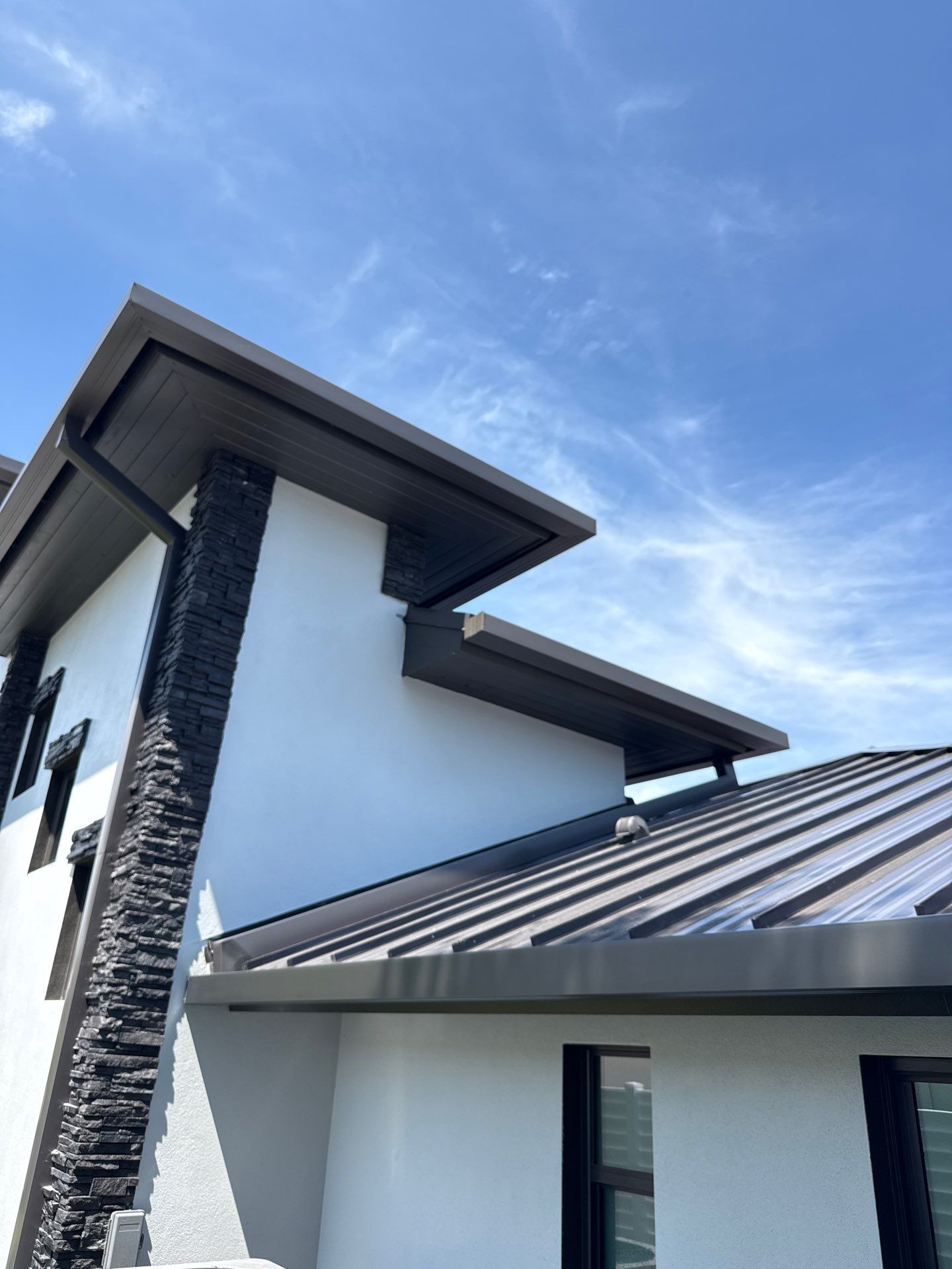 7-Inch Smooth Box Seamless Gutters using black seamless gutters in Siesta Key Fl by Gutter Professors