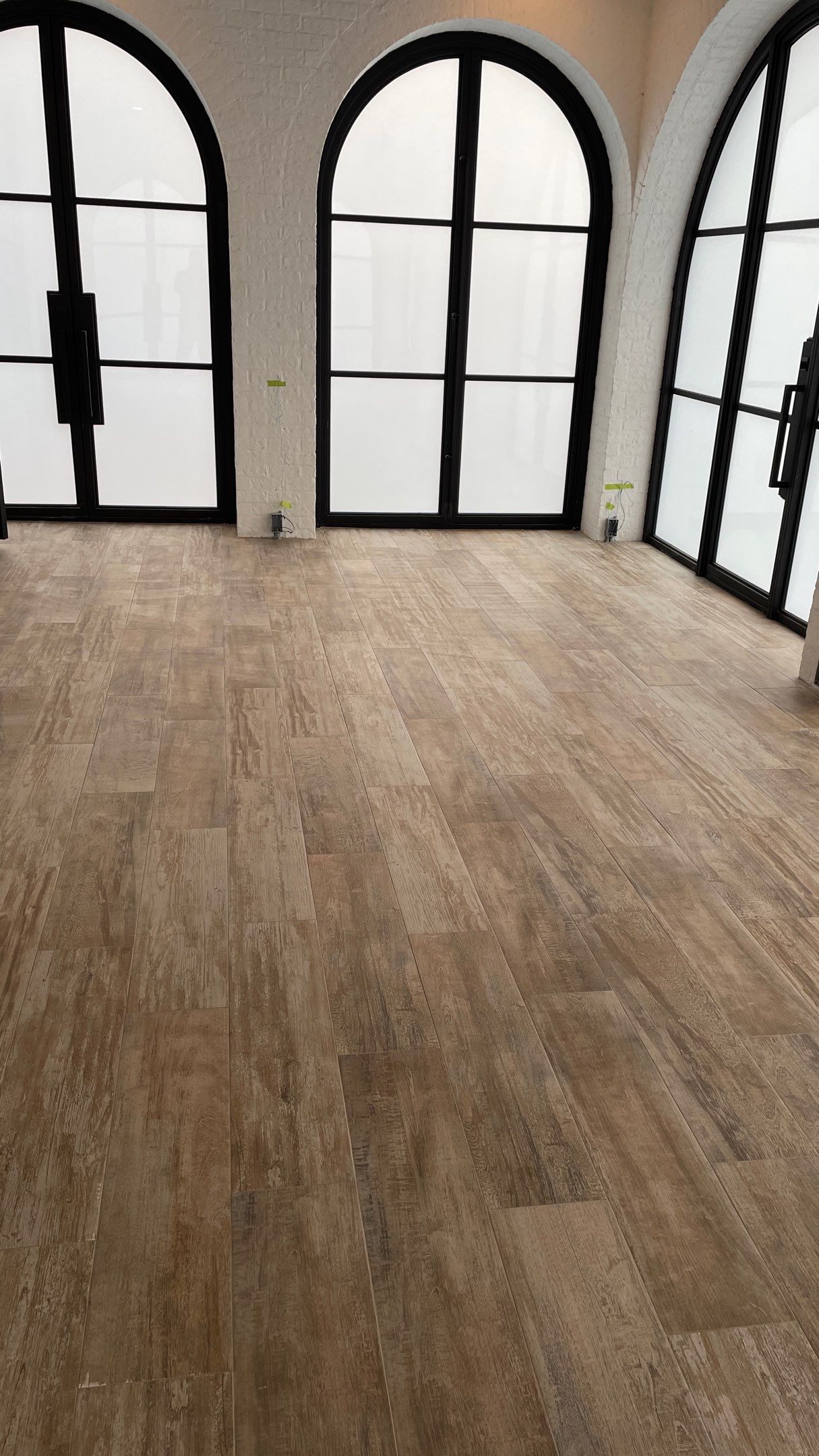 Instant Transformation of this Beautiful Sunroom by Footprints Floors of Coastal Carolina