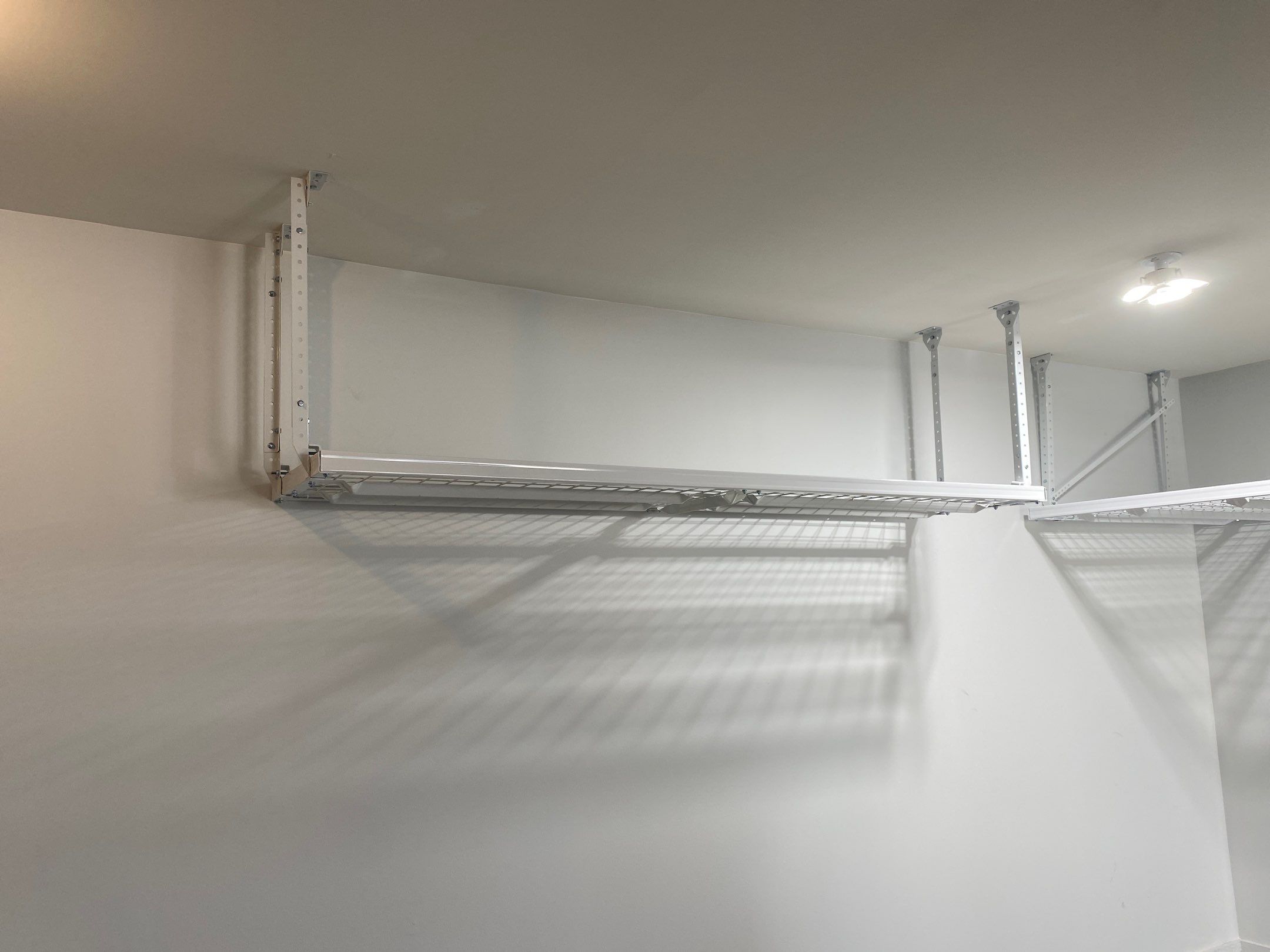 Mark W. added overhead racks to his garage by Banner Garage