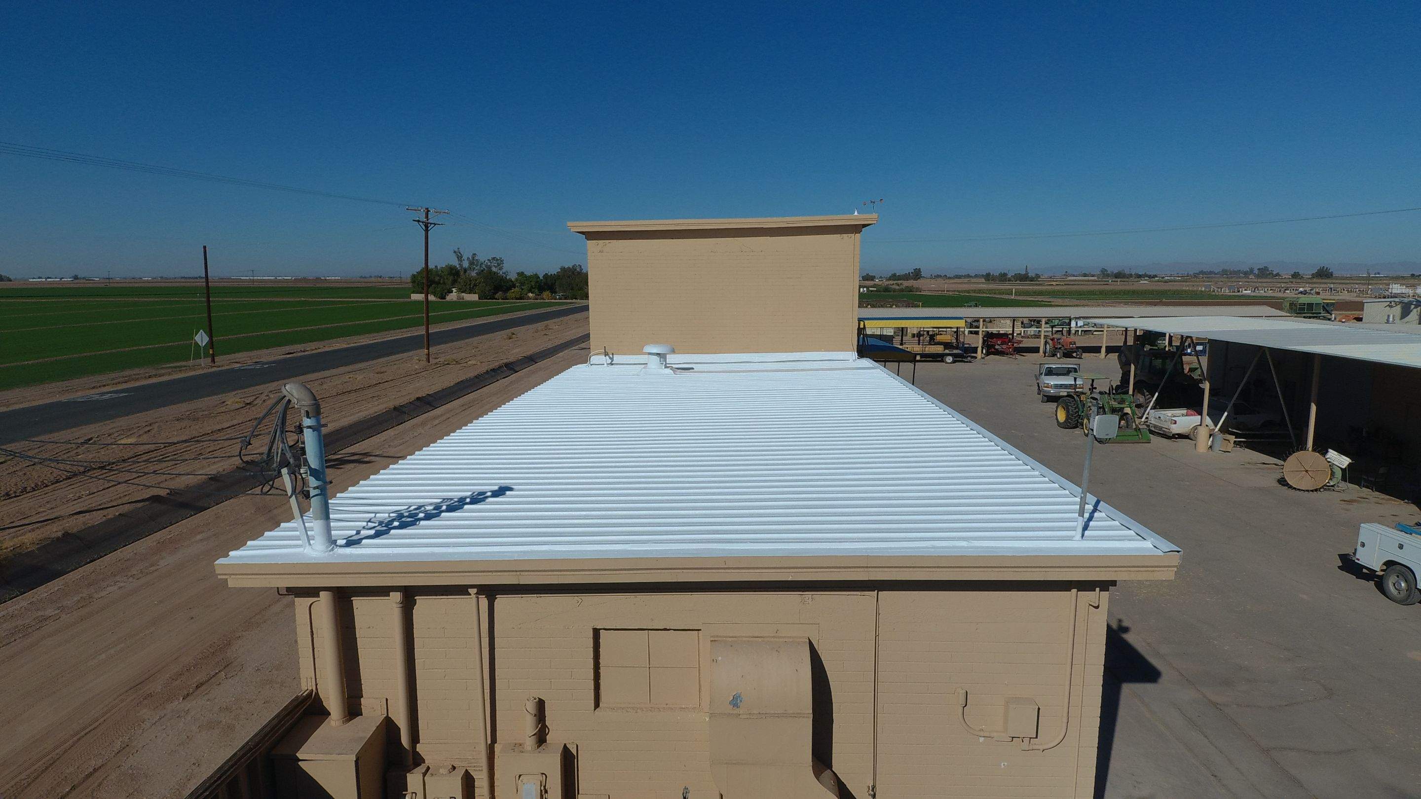 Metal roof restoration on commercial roof using Conklin Benchmark/PUMA XL fabric and coating by Straight Edge Roofing Inc