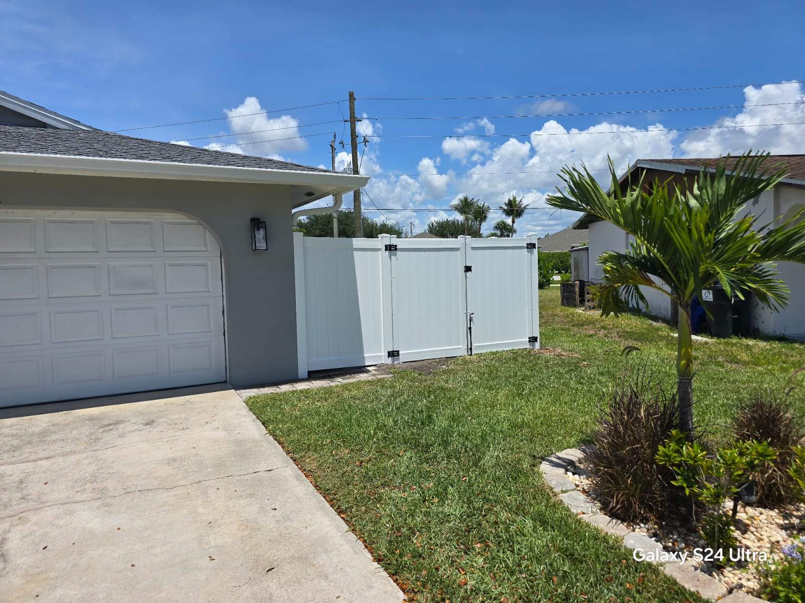White Vinyl Privacy Fence and Double Gate Installation in Fort Myers by True Fence LLC