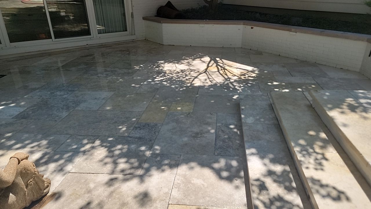 marble patio cleaning and sanding using Polysweep polymeric sand by Northern Power Washing LLC.