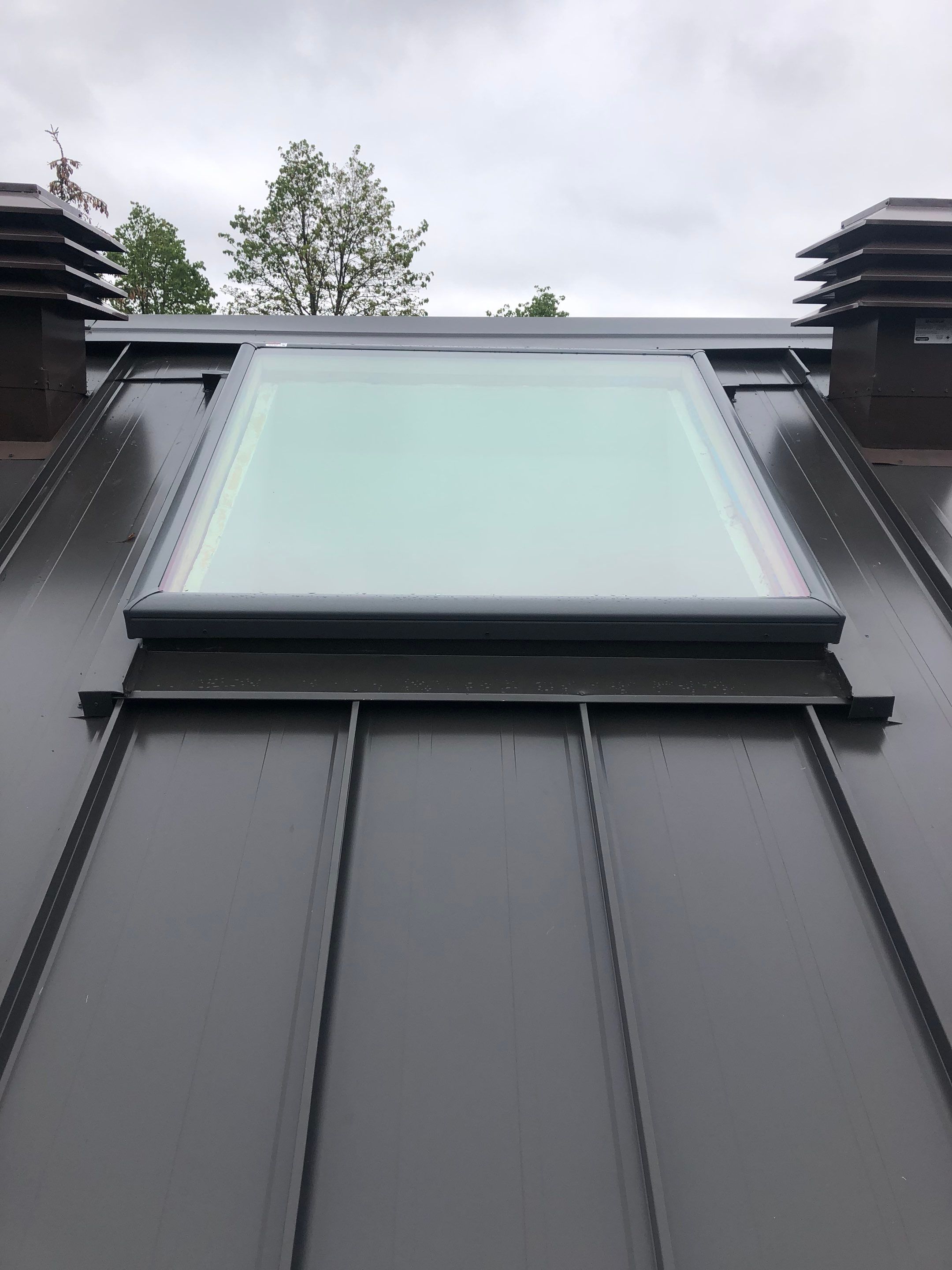 Residential Roofing Installation using 16" Standing Seam Panels by Jay Carter Roofing & Sheet Metal