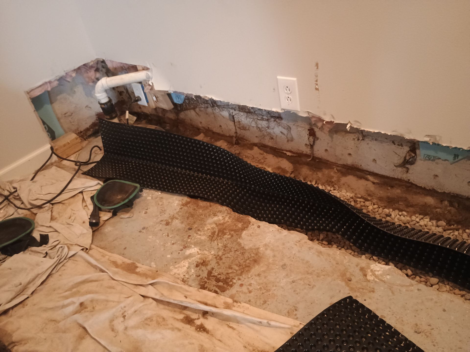 Interior Drain Tile in a Finished South Minneapolis Basement by Waterproofing Northeast