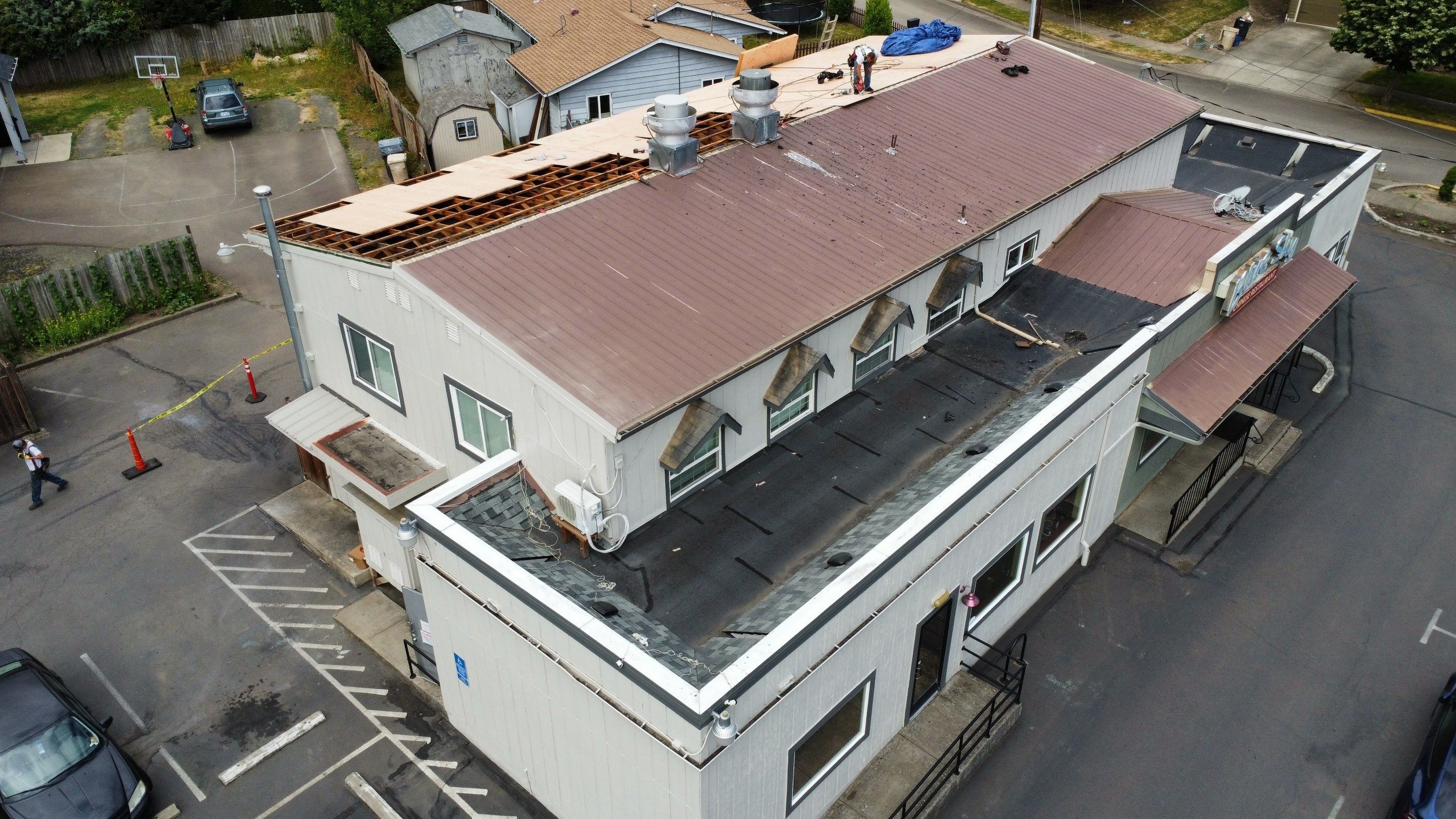 Commercial Flat Roof Installation using Bruce and Dana Snap Lock Metal (Color: Brown) by Orezona Building & Roofing Company, Inc.