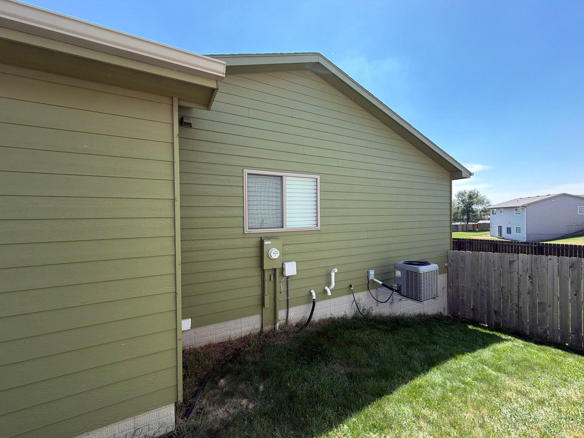 Exterior Painting and Custom Deck Construction in Sioux Falls by Select Painting, Coatings & Garage Cabinets