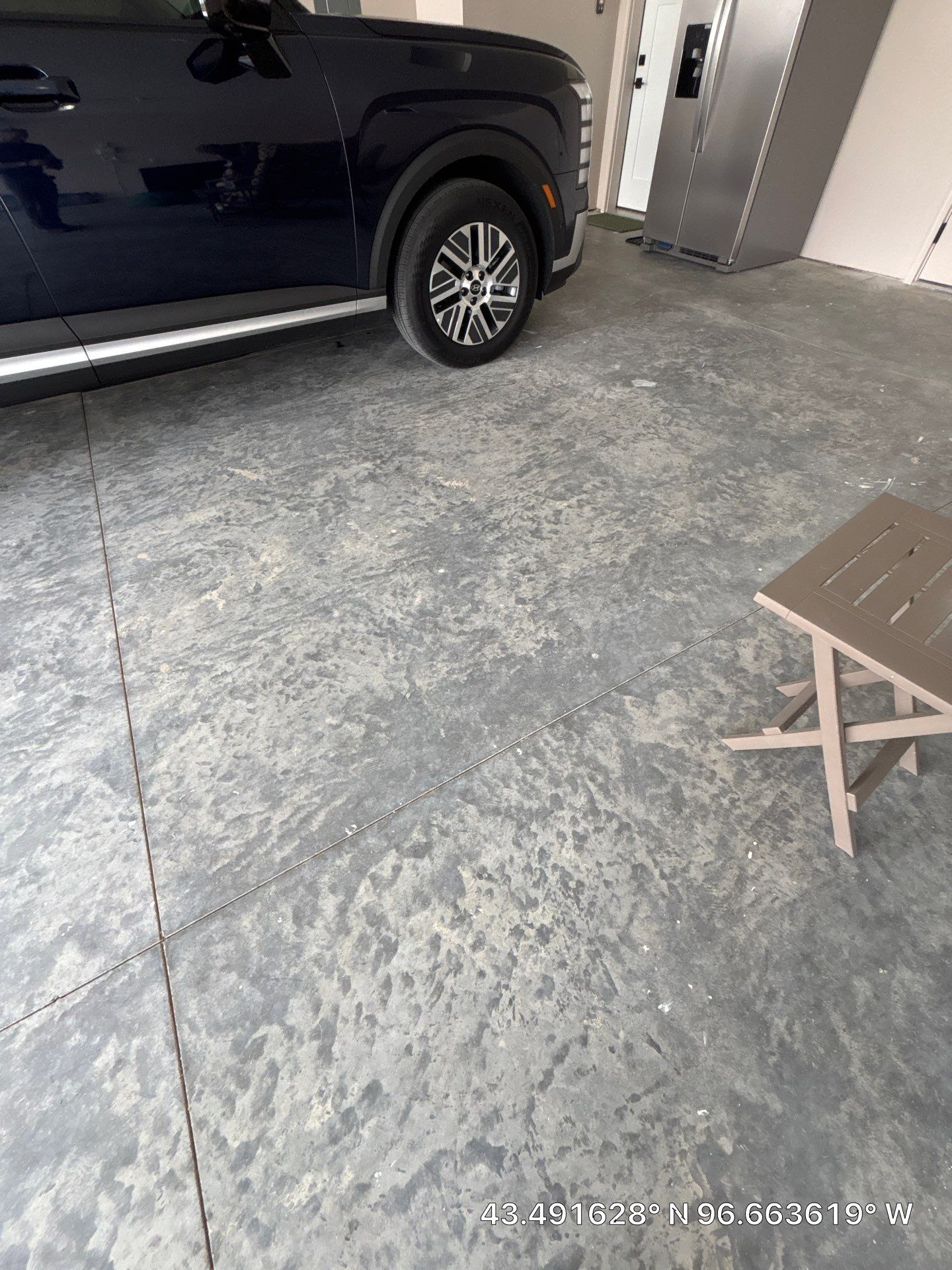 Full Speckled Concrete Coating for Sioux Falls Garage by Select Painting, Coatings & Garage Cabinets