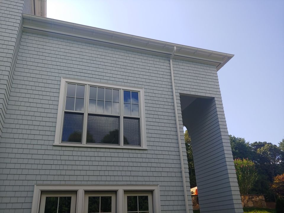 Gutter Installation using 6" Half Round Aluminum Gutter over Crown Moulding by Gutter Pro Enterprises