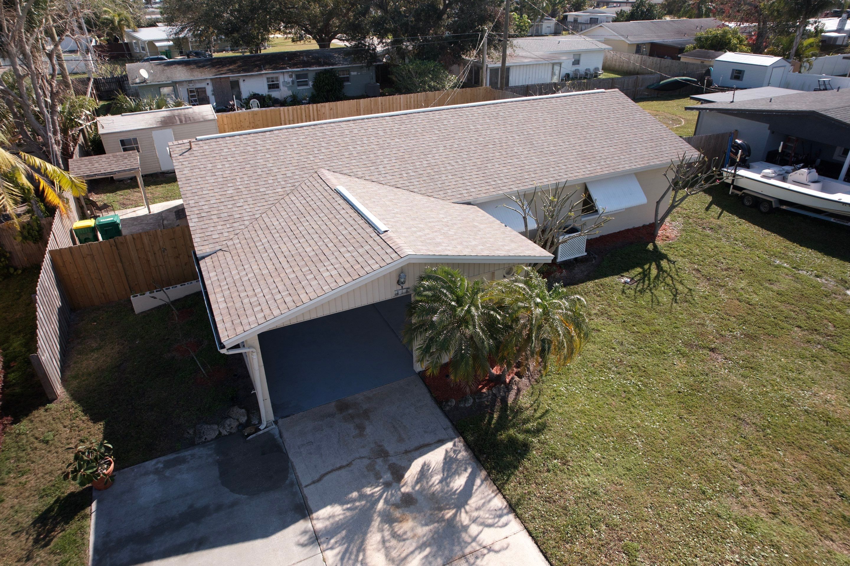 Complete Asphalt Shingle and Flat Roof Replacement in Merritt Island by Wiedmann Construction & Roofing
