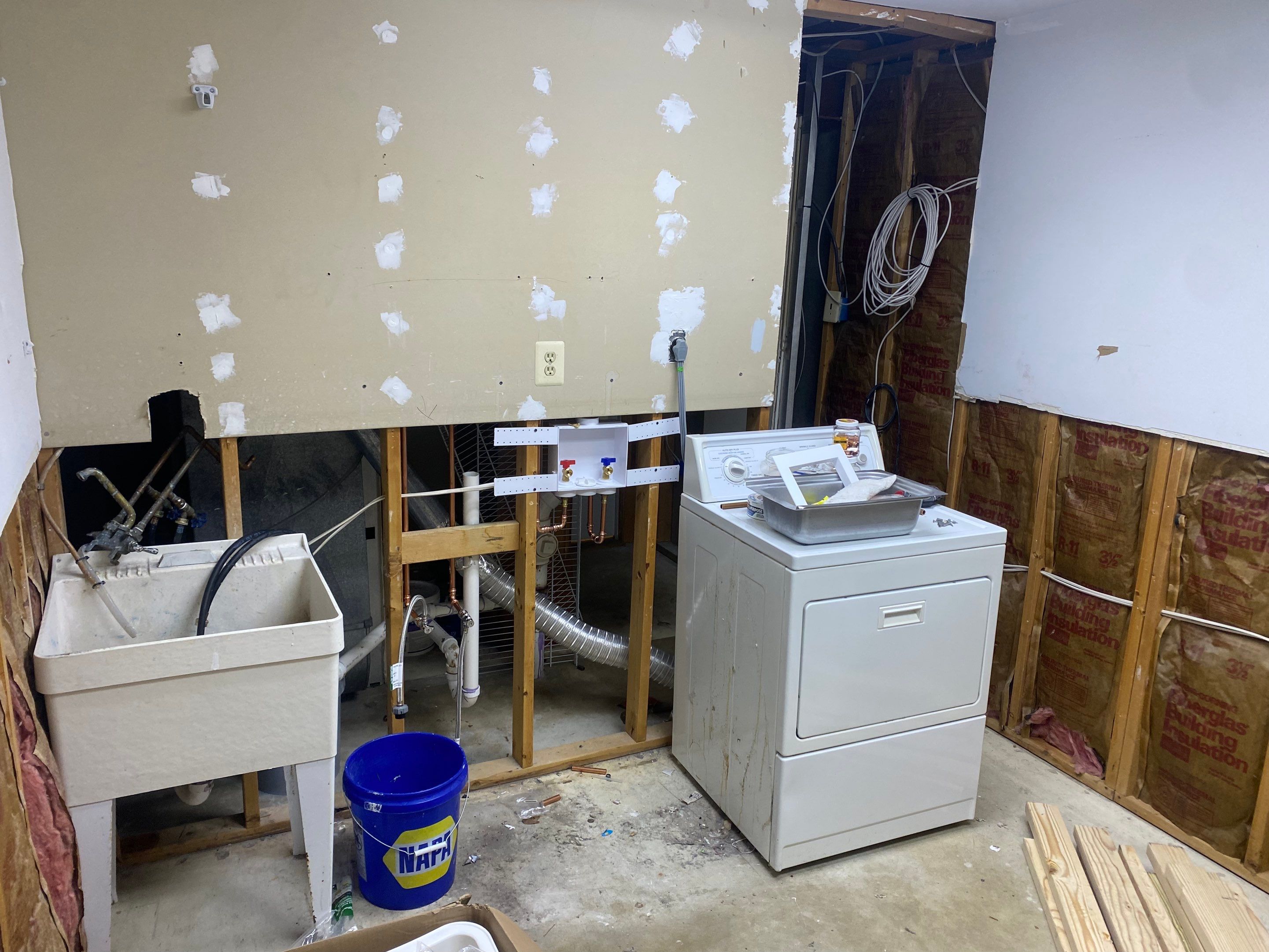Laundry Room Redmodel using Lifeproof Luxury Vinyl Plank Flooring by The Smet Companies, LLC