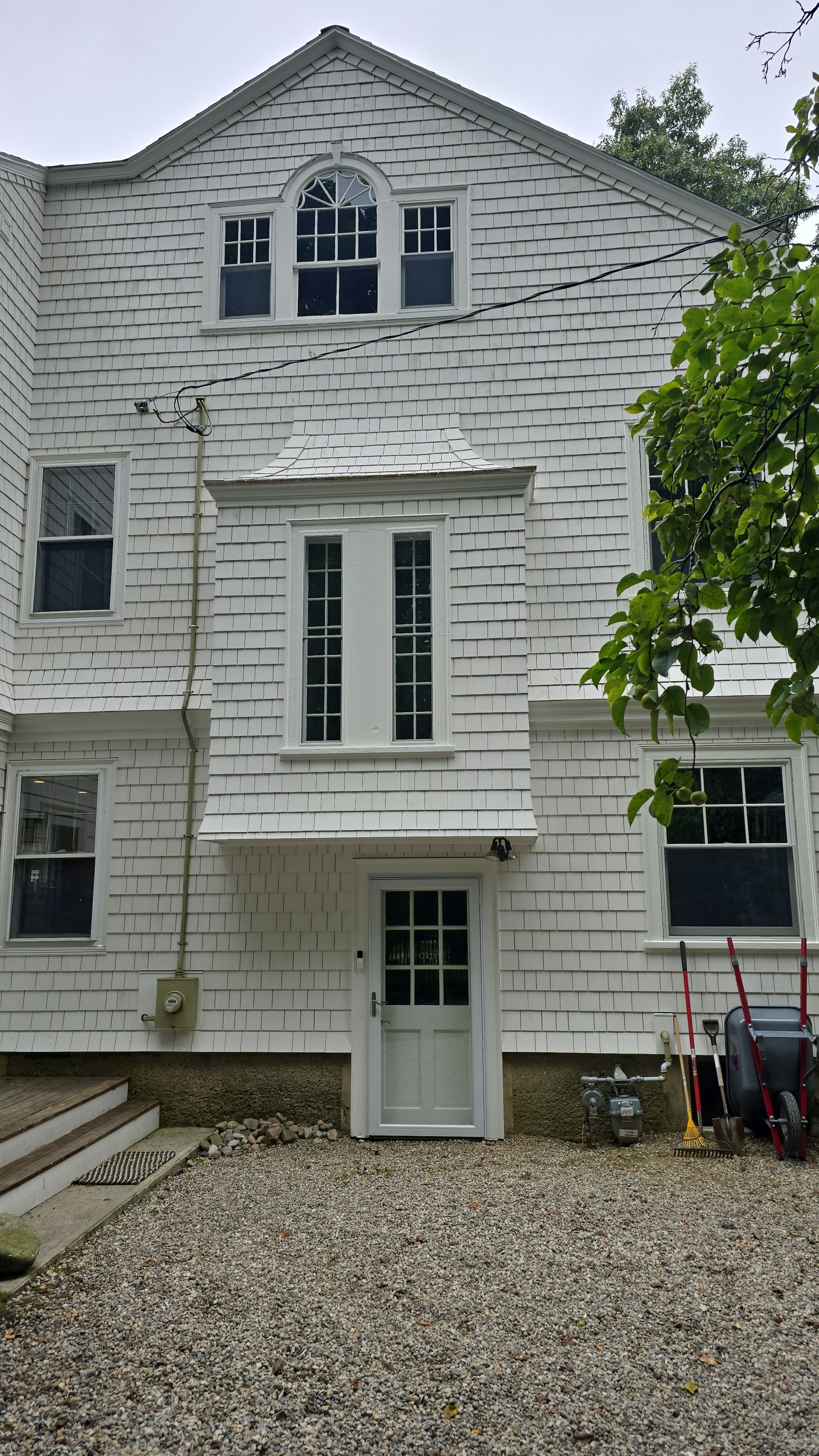 White cedar shingles and windows in Wayland, MA by UBrothers Construction