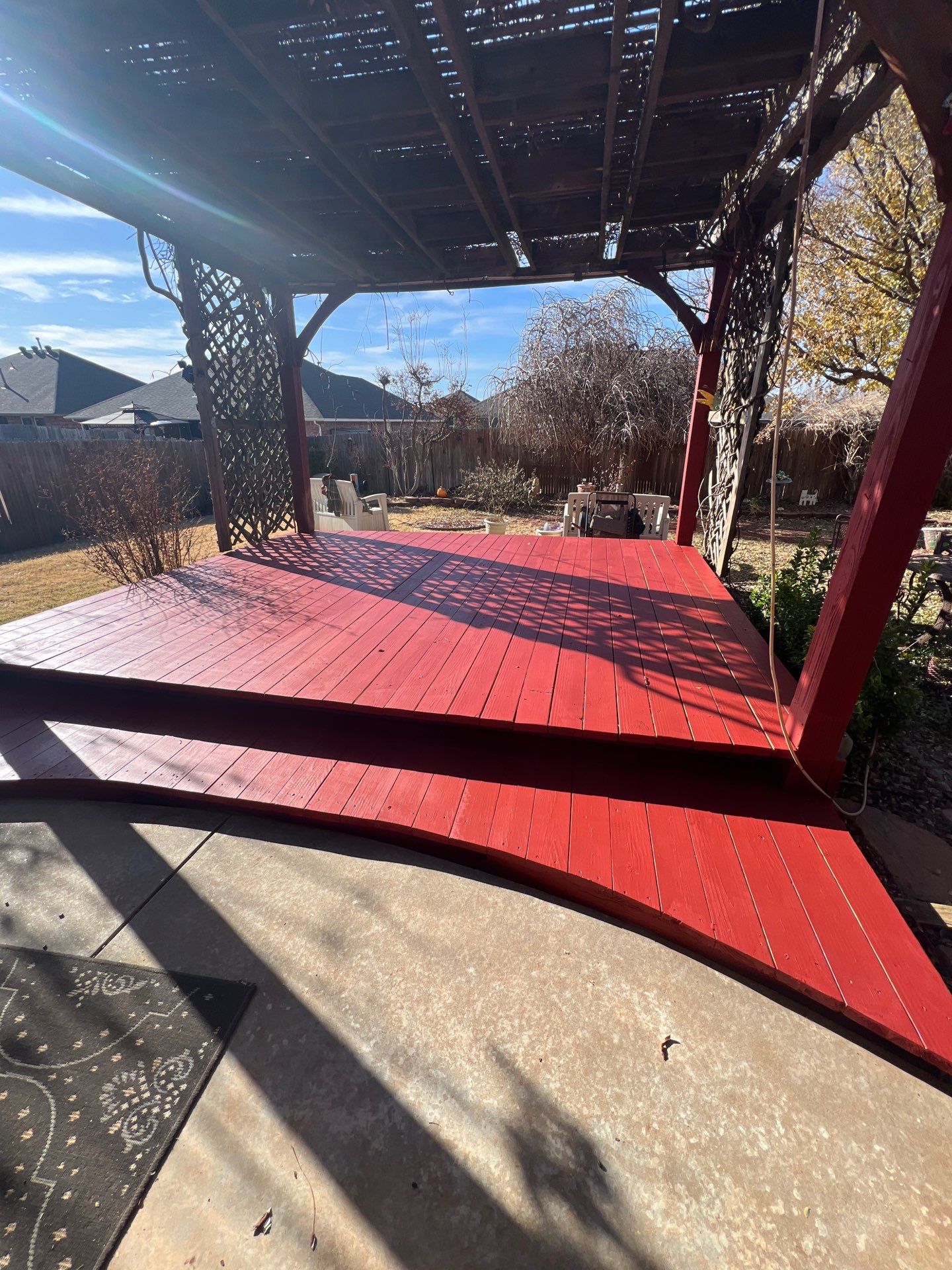 pergola installation and painting in Yukon by McCann's Roofing and Construction