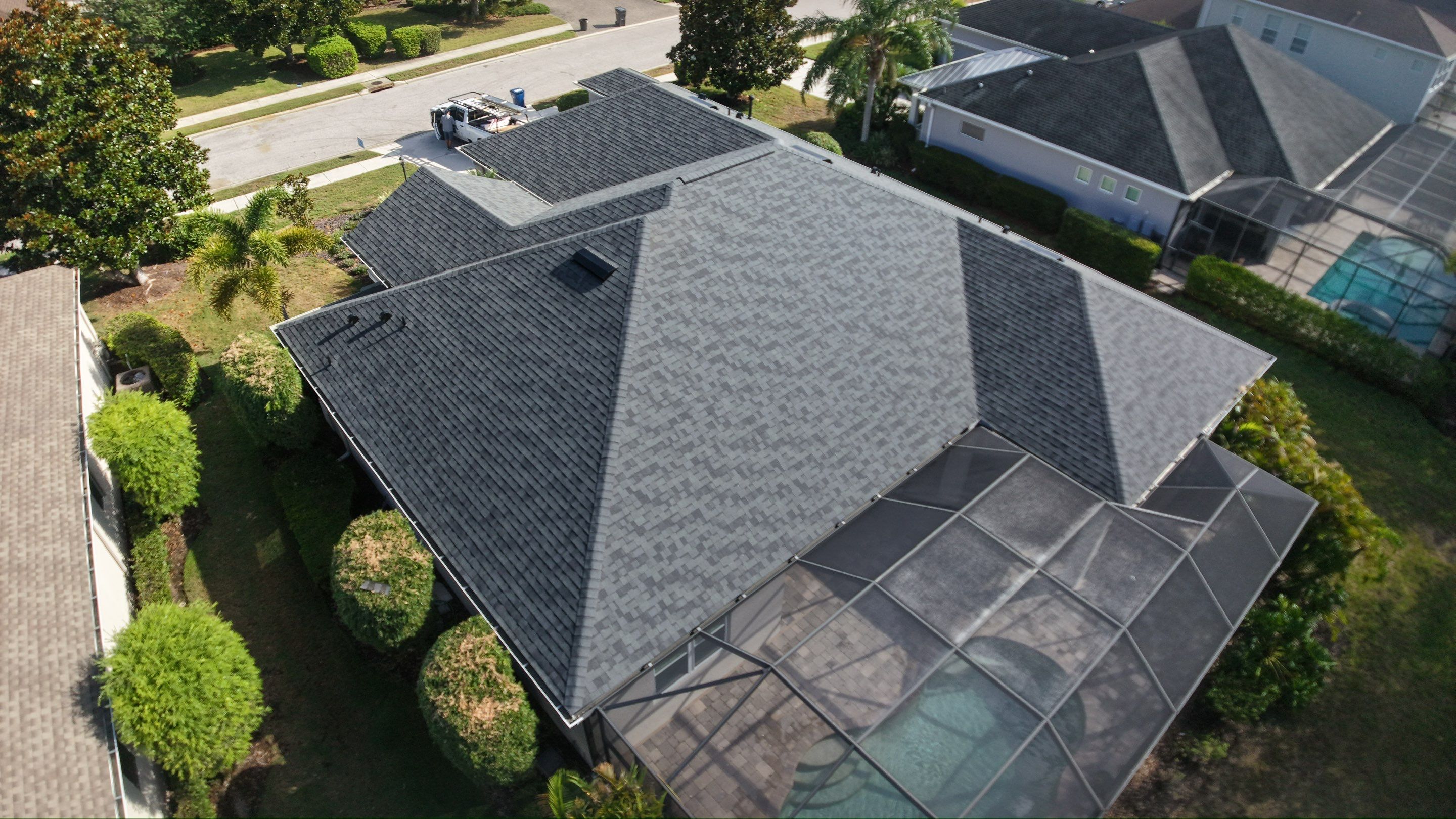 Residential Roof Installation With Estate Grey Architectural Shingles in Bradenton by Trinity Restoration and Roofing LLC