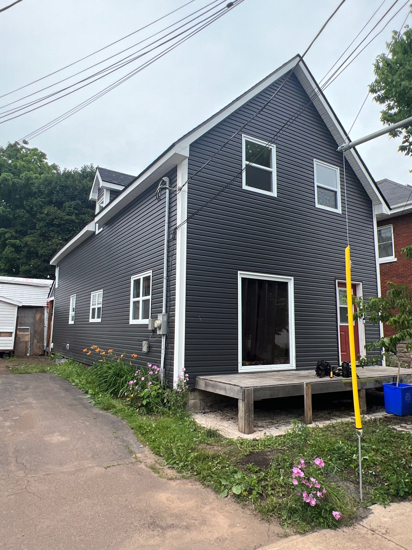 Exterior Renovation using New Roofing and Siding by Bobby Built