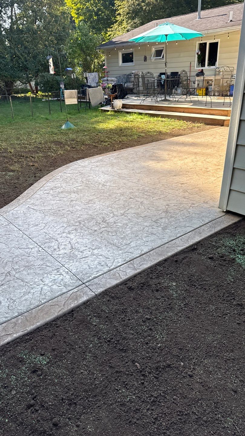 Oxford slate stamped patio  by NG Masonry & Construction LLC