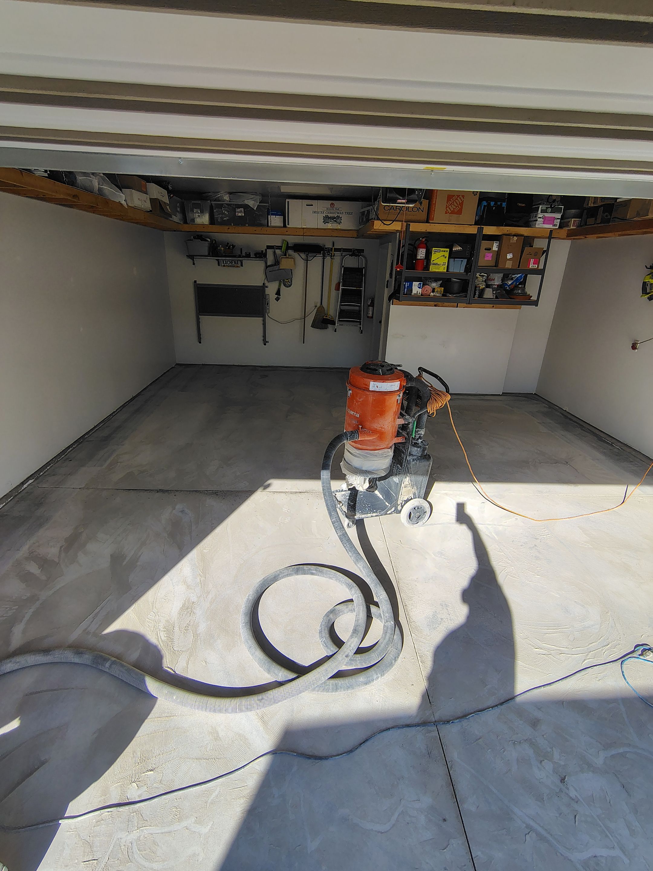 Decorative Chip Garage Concrete Coating Installation in Sioux Falls by Select Painting, Coatings & Garage Cabinets