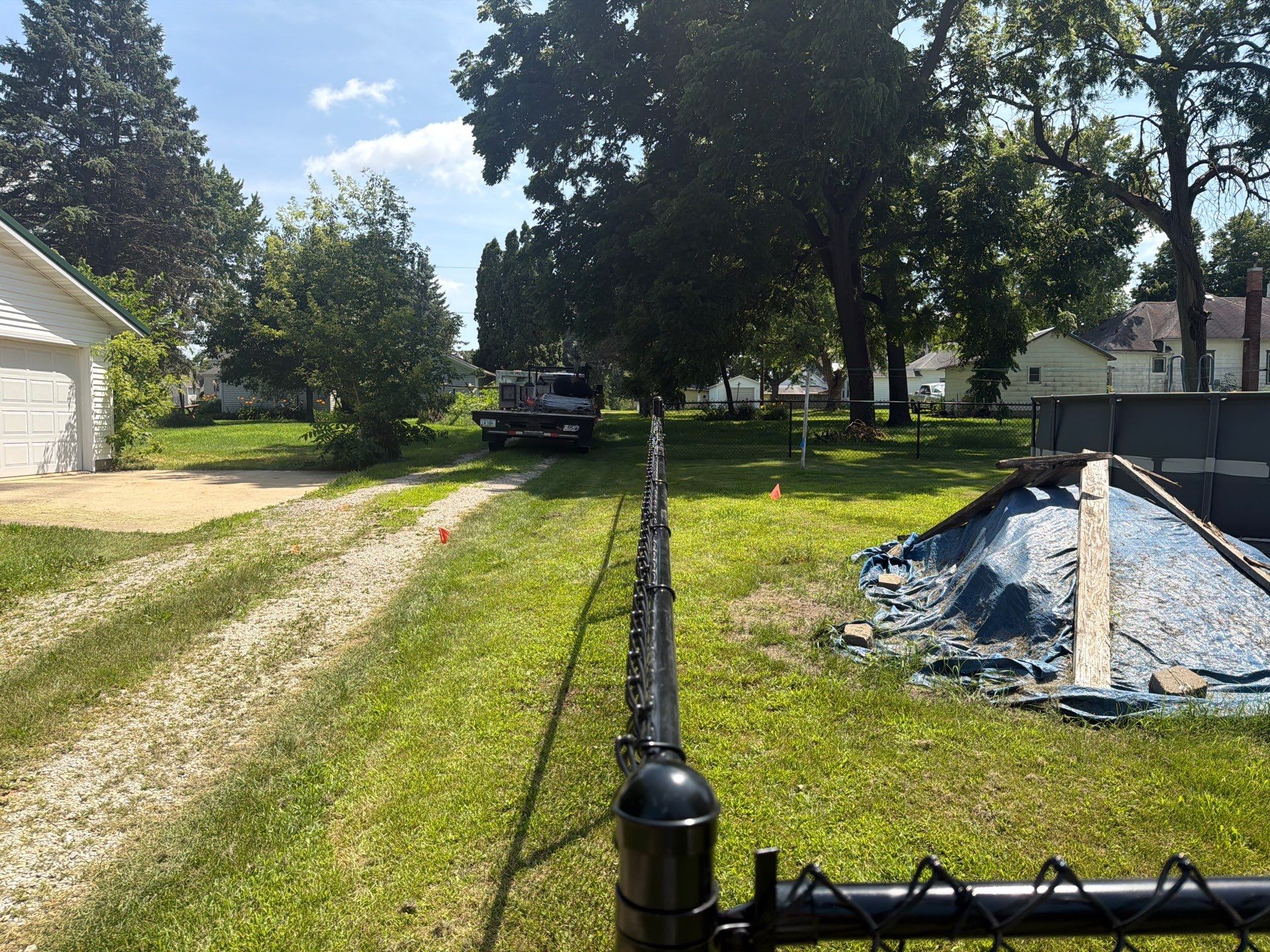 Black Chain Link Backyard Fence Installation in Tripoli, IA by Perfect Picket Fence and Stain