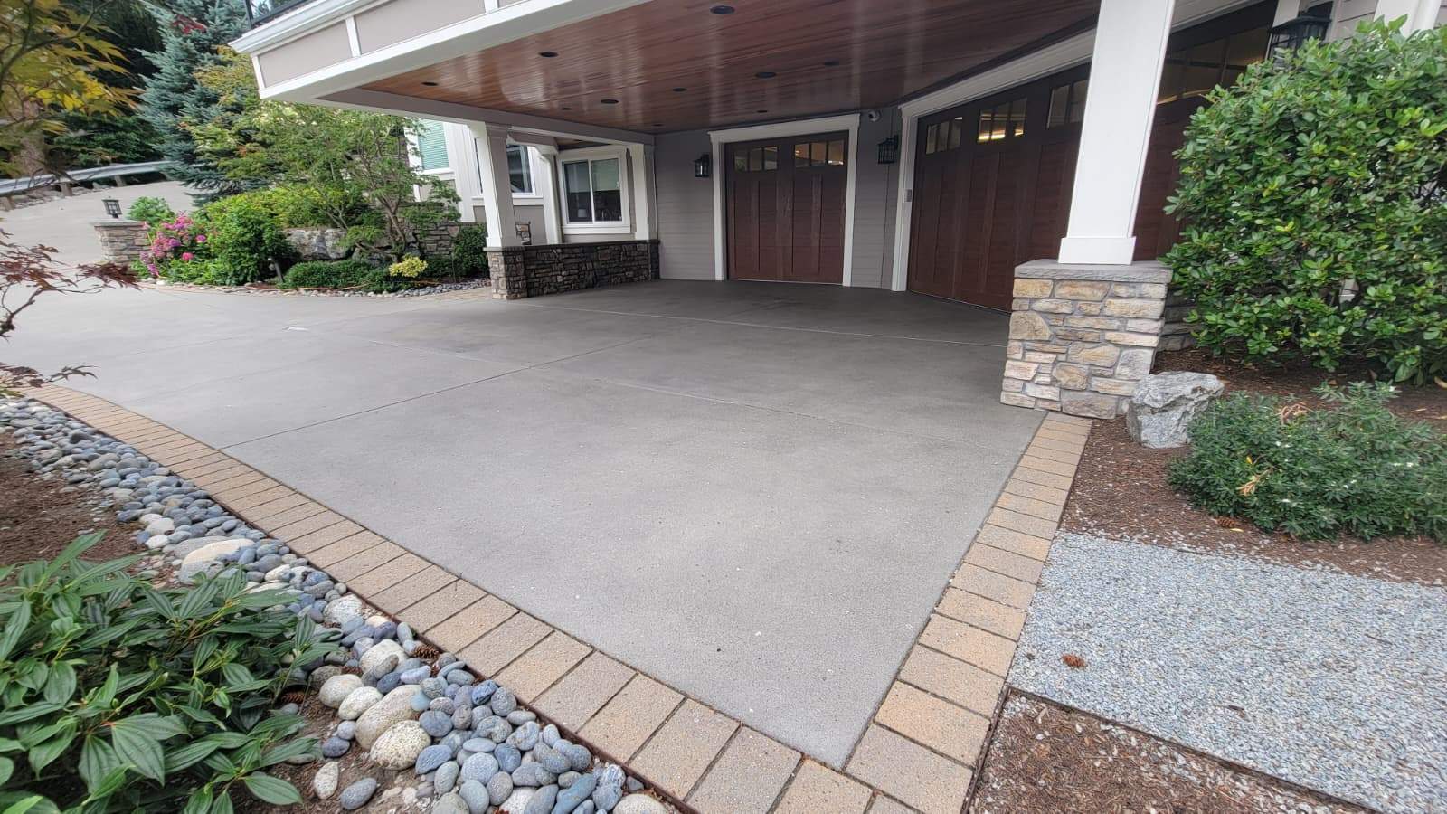 Coastal Grandeur Driveway and Patio in Big Sur Vuba Stone by Concrete Coating Experts Inc.