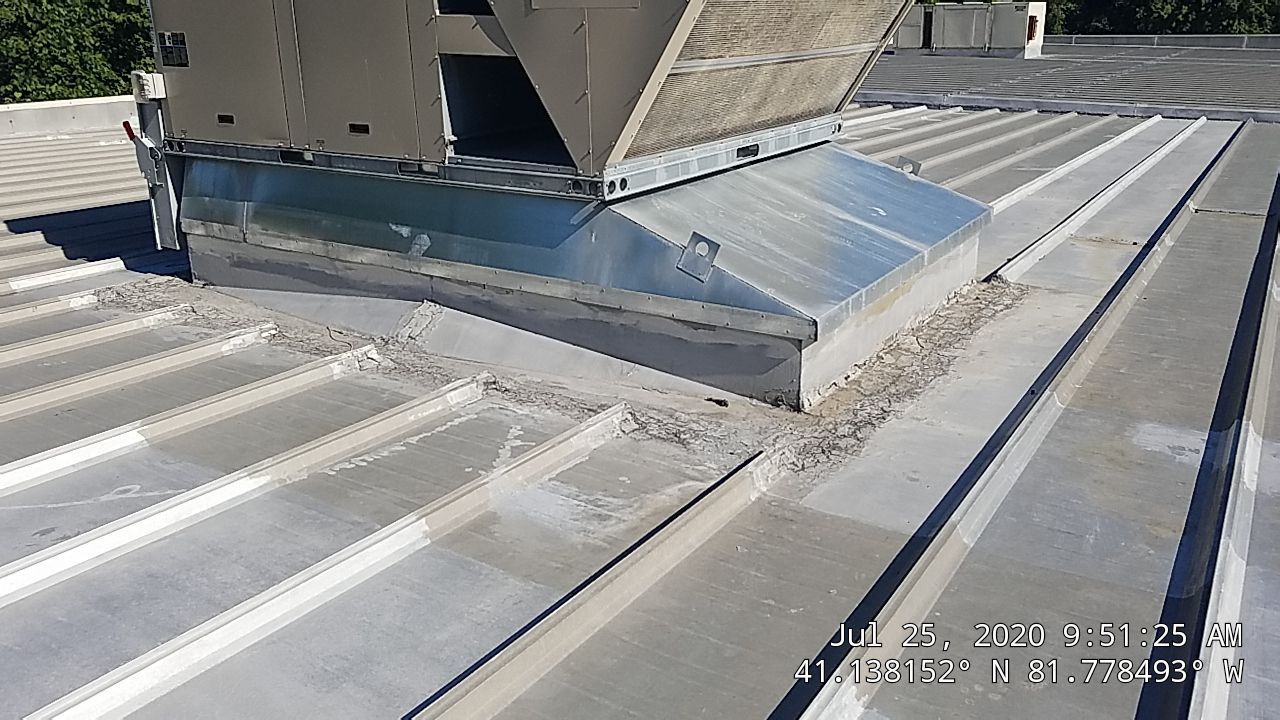 Commercial Metal Roof Coating by Gold Star Roofing LLC