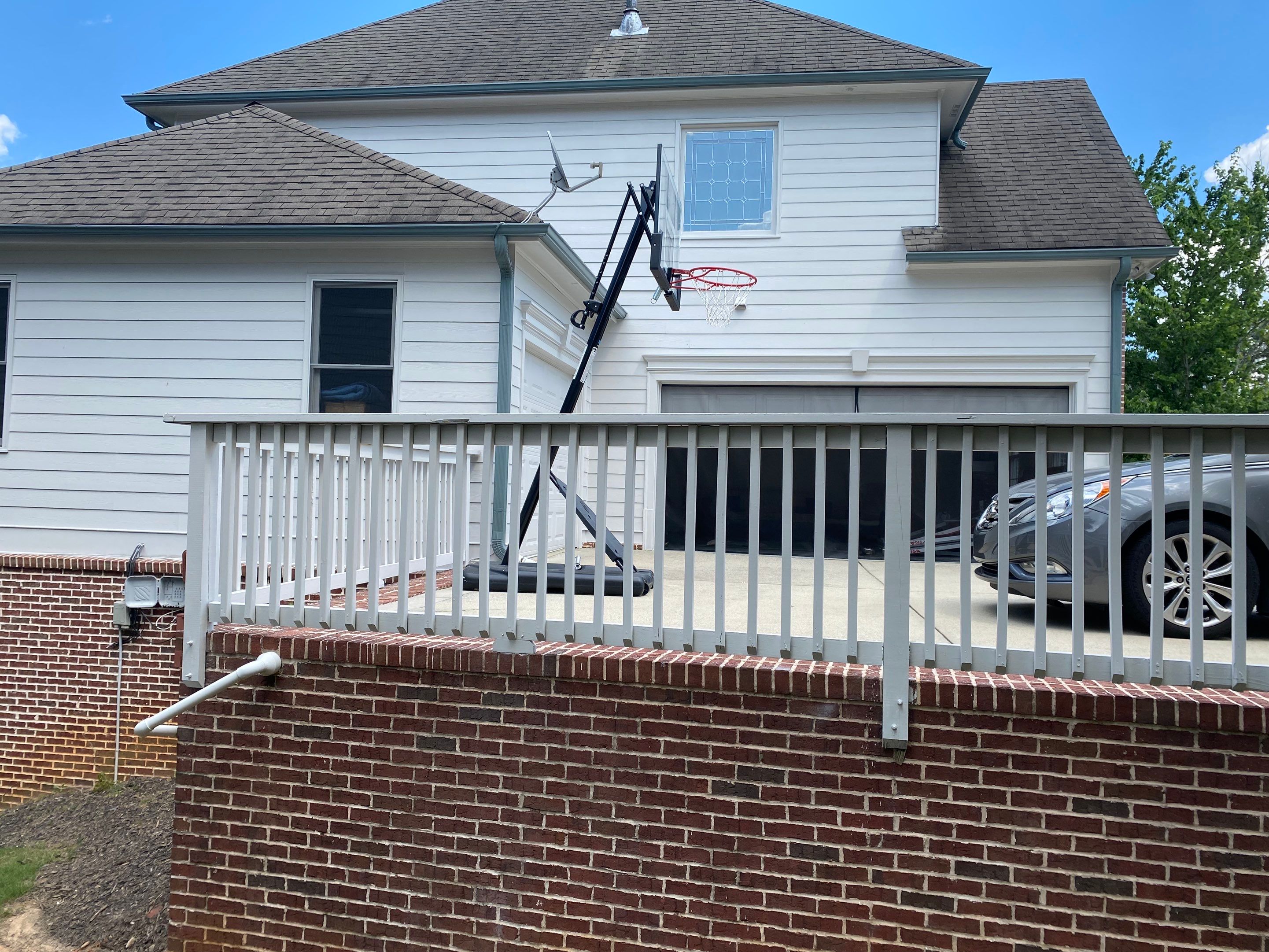 Exterior Painting and Deck Refinishing for Dacula Residential Home by Swift Home Renovations