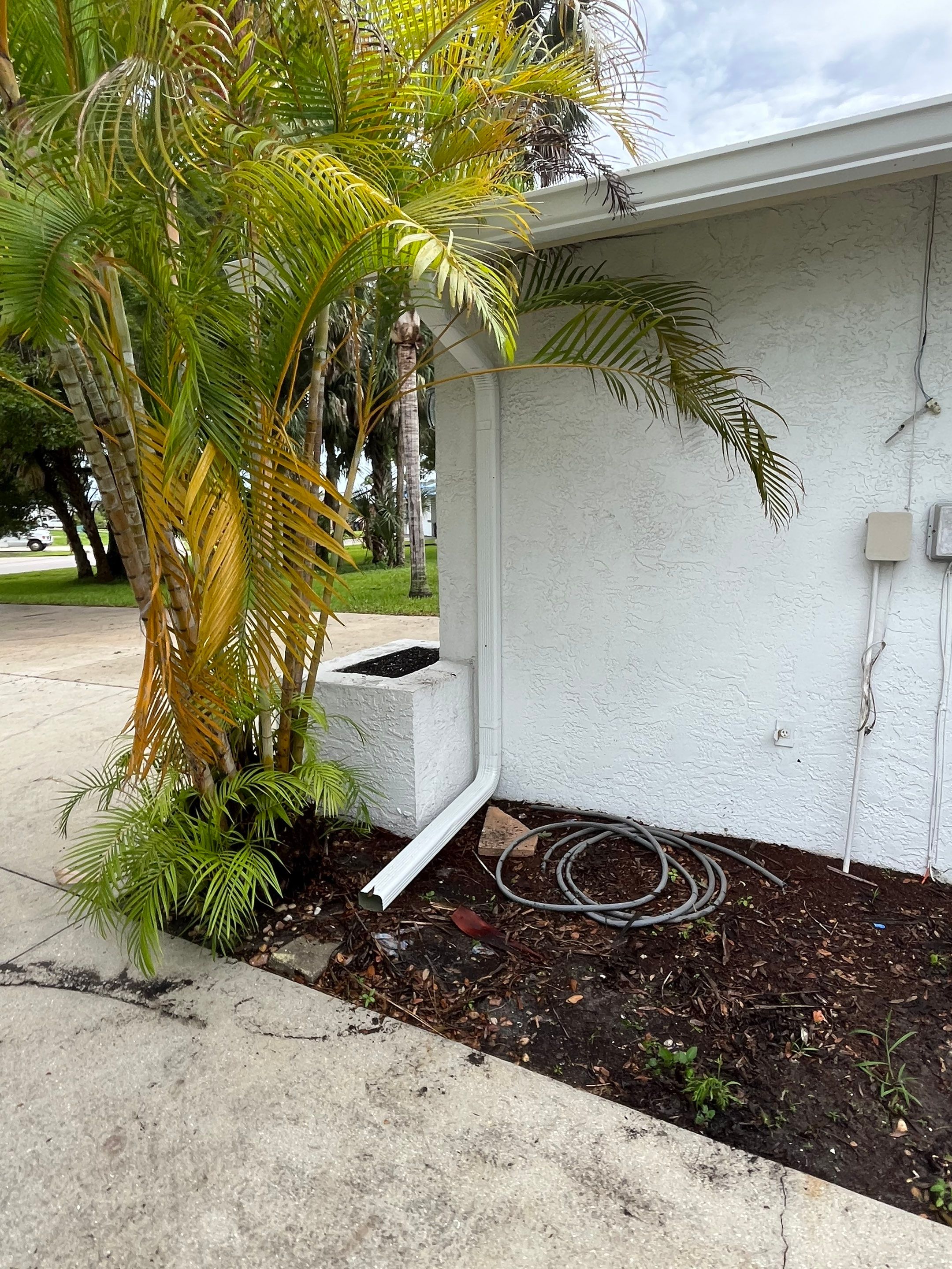 White Seamless Gutters with Splash Guards in North Fort Myers FL by Gutter Professor   by Gutter Professors